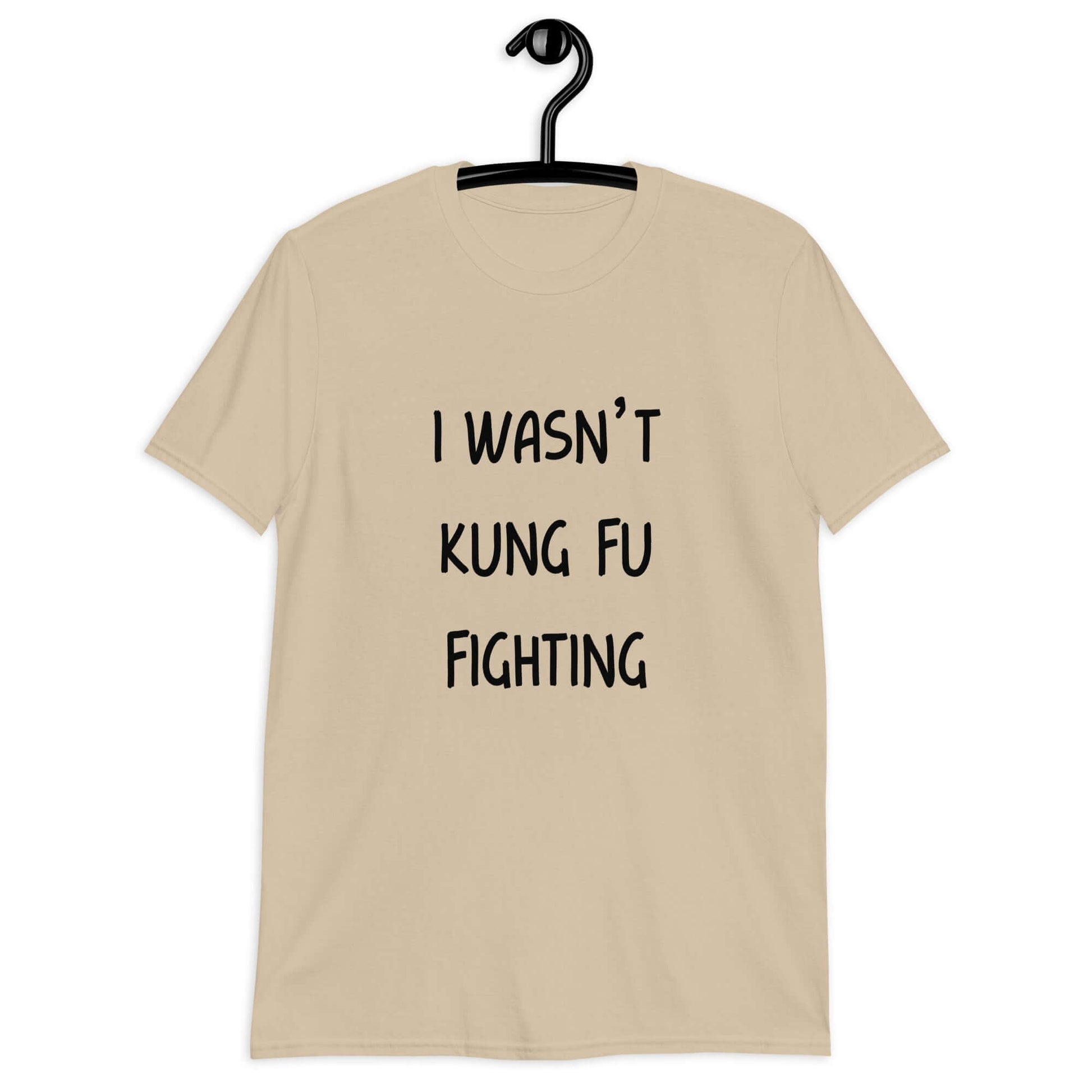 Sand color t-shirt with the funny phrase I wasn't kung fu fighting printed on the front.