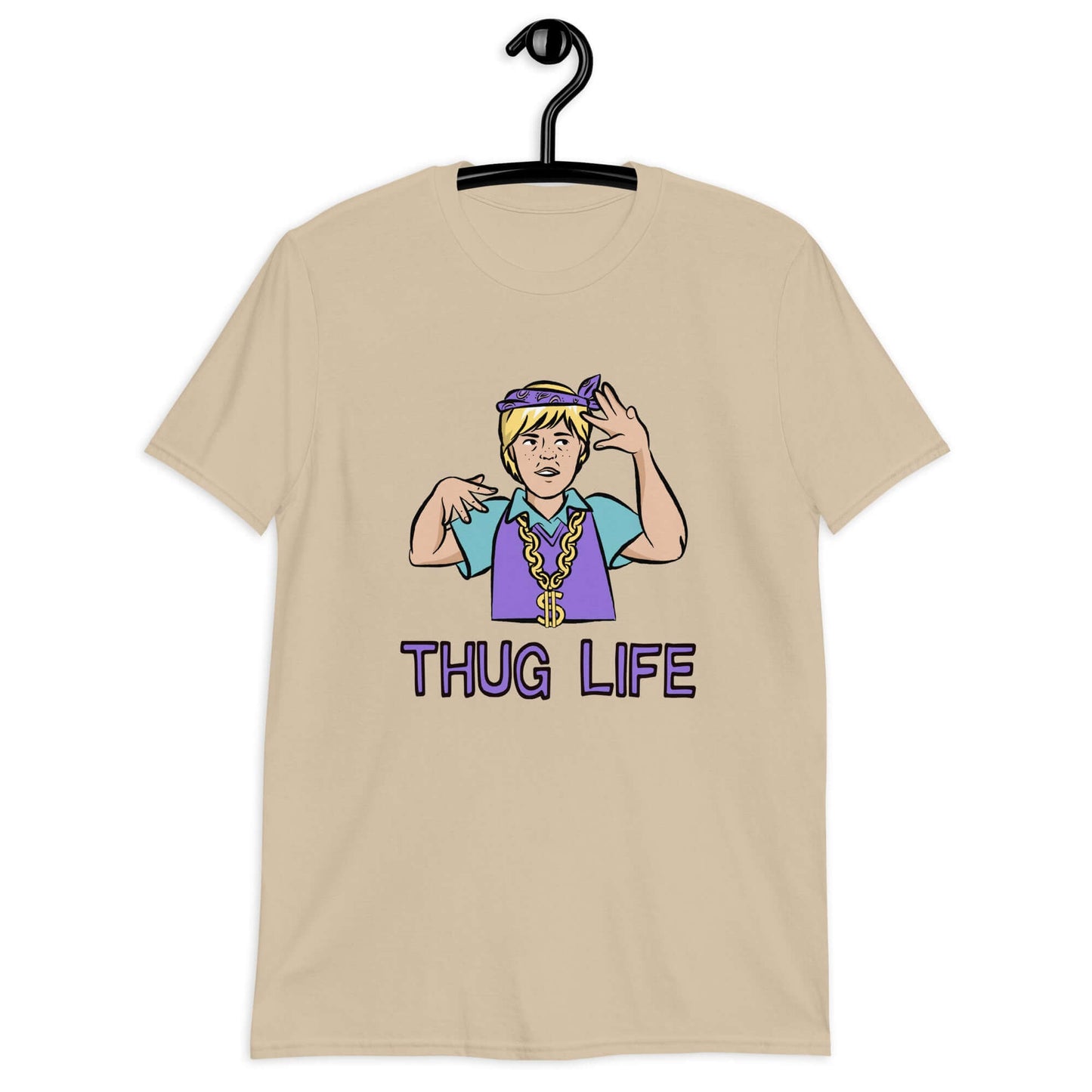 Sand color t-shirt with a parody image of a blond haired child trying to be a gangster with the words Thug Life printed on the front.