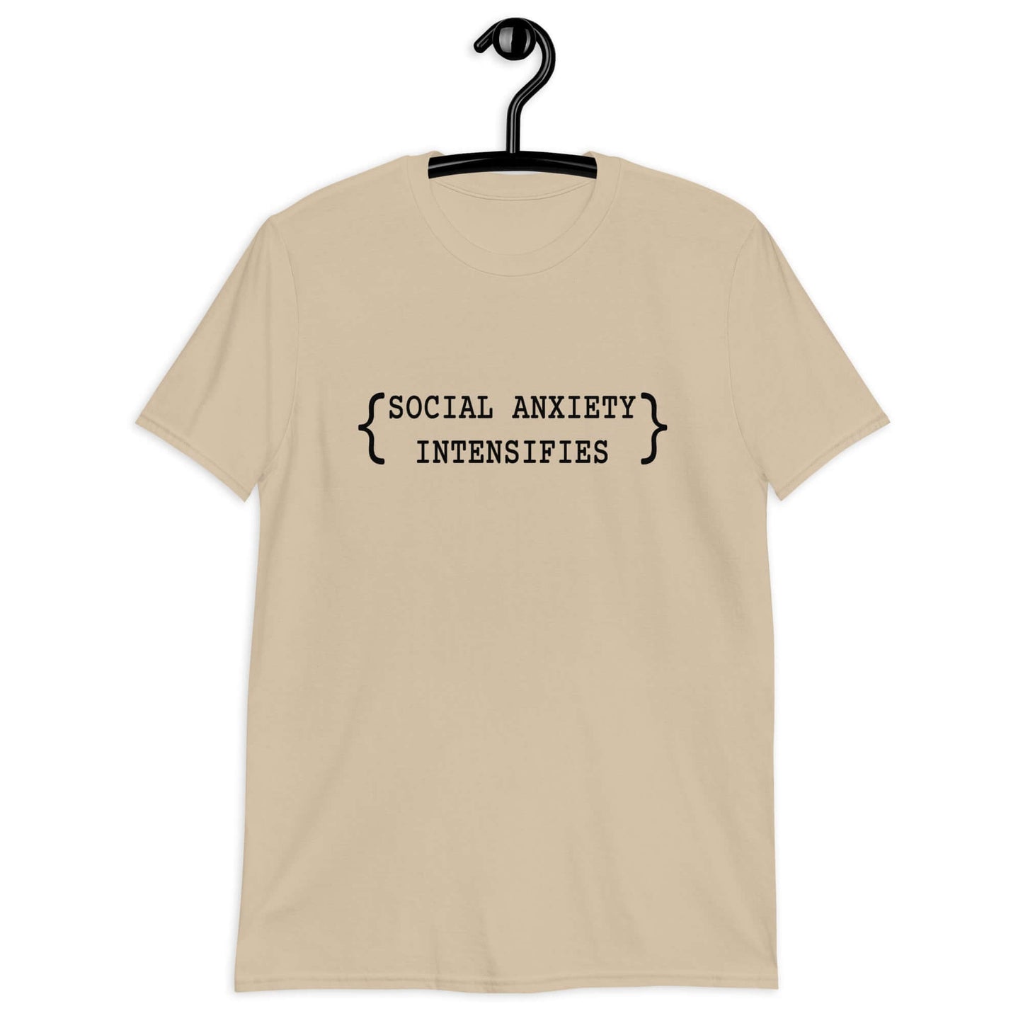 Sand color t-shirt with the words Social anxiety intensifies printed on the front.