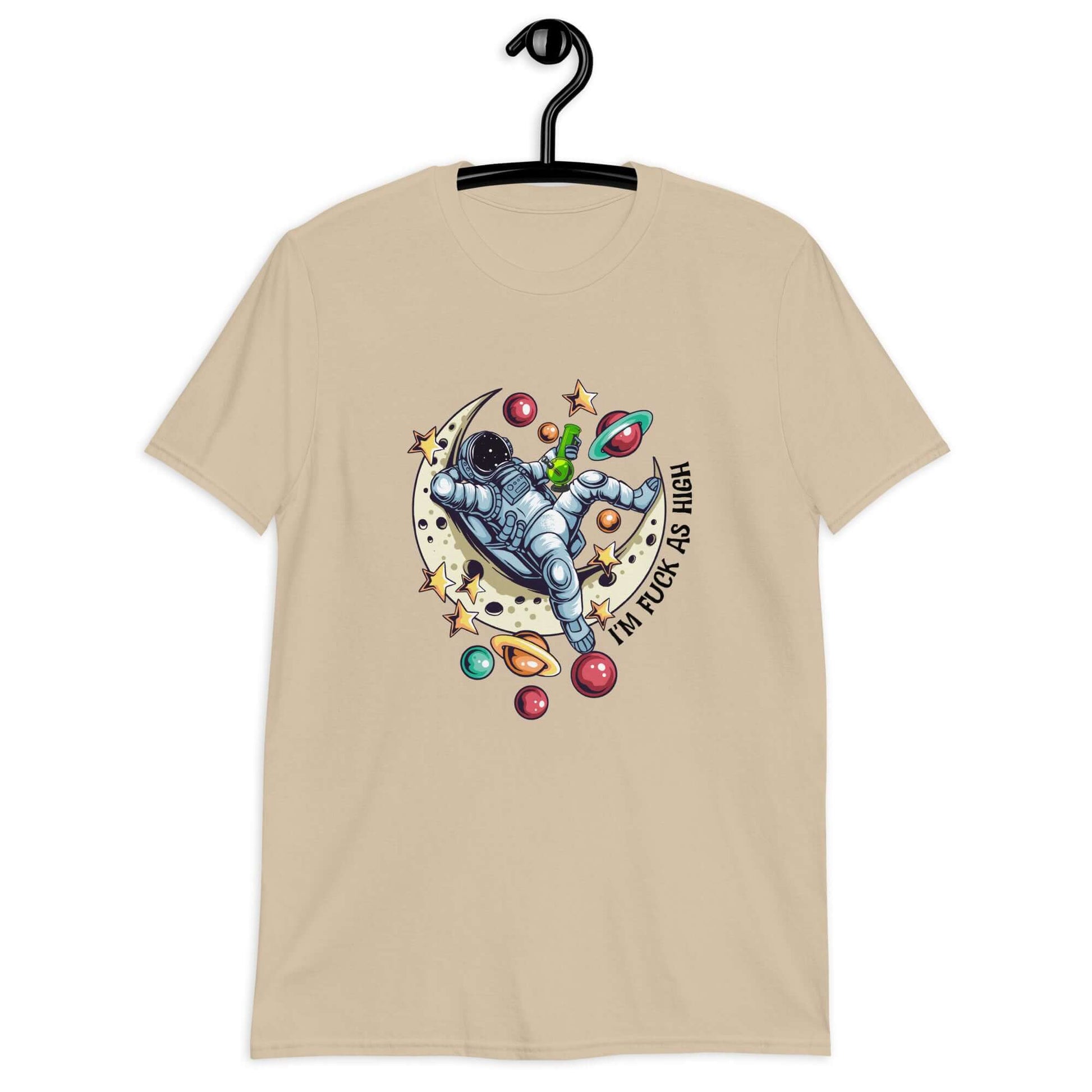 Sand color t-shirt with graphic of an astronaut sitting on the moon while smoking a bong with the phrase I'm fuck as high printed on the front.