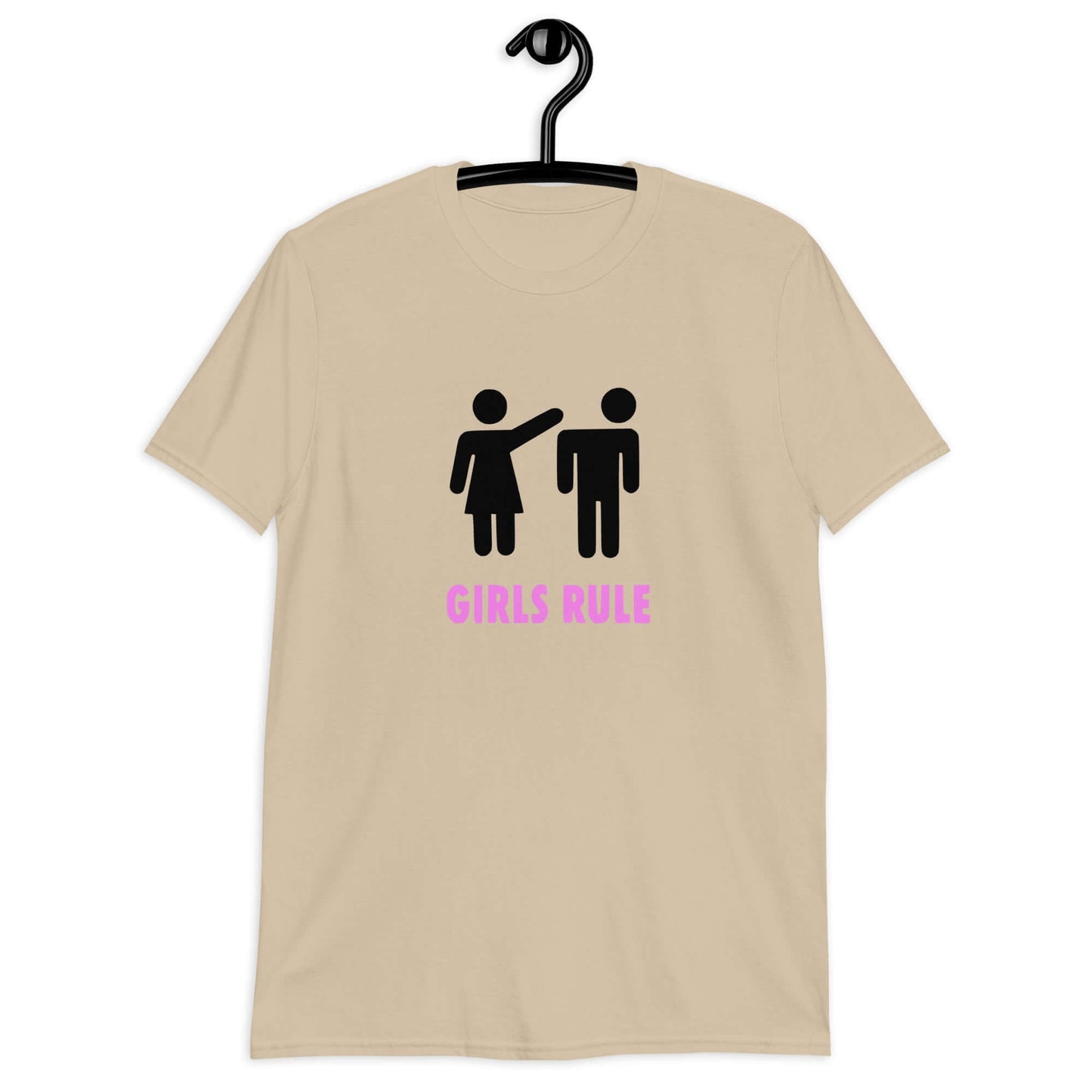 Sand color t-shirt with an image of a stick figure man and woman. The stick woman is punching the stick mans head off and the words Girls rule is printed beneath in hot pink. The graphics are printed on the front of the shirt.