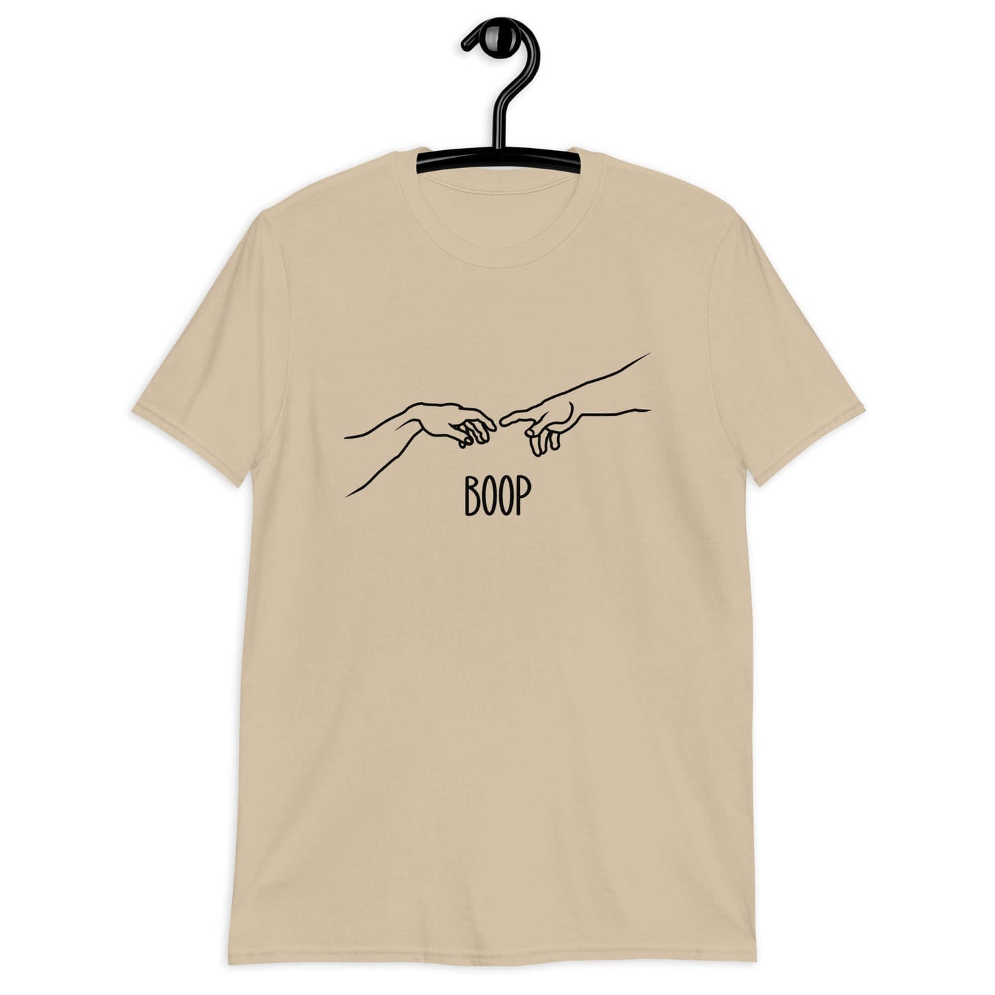 Sand color t-shirt with line drawing hands reaching out and touching in the center like they in the famous art creation of Adam. The word Boop is printed underneath.