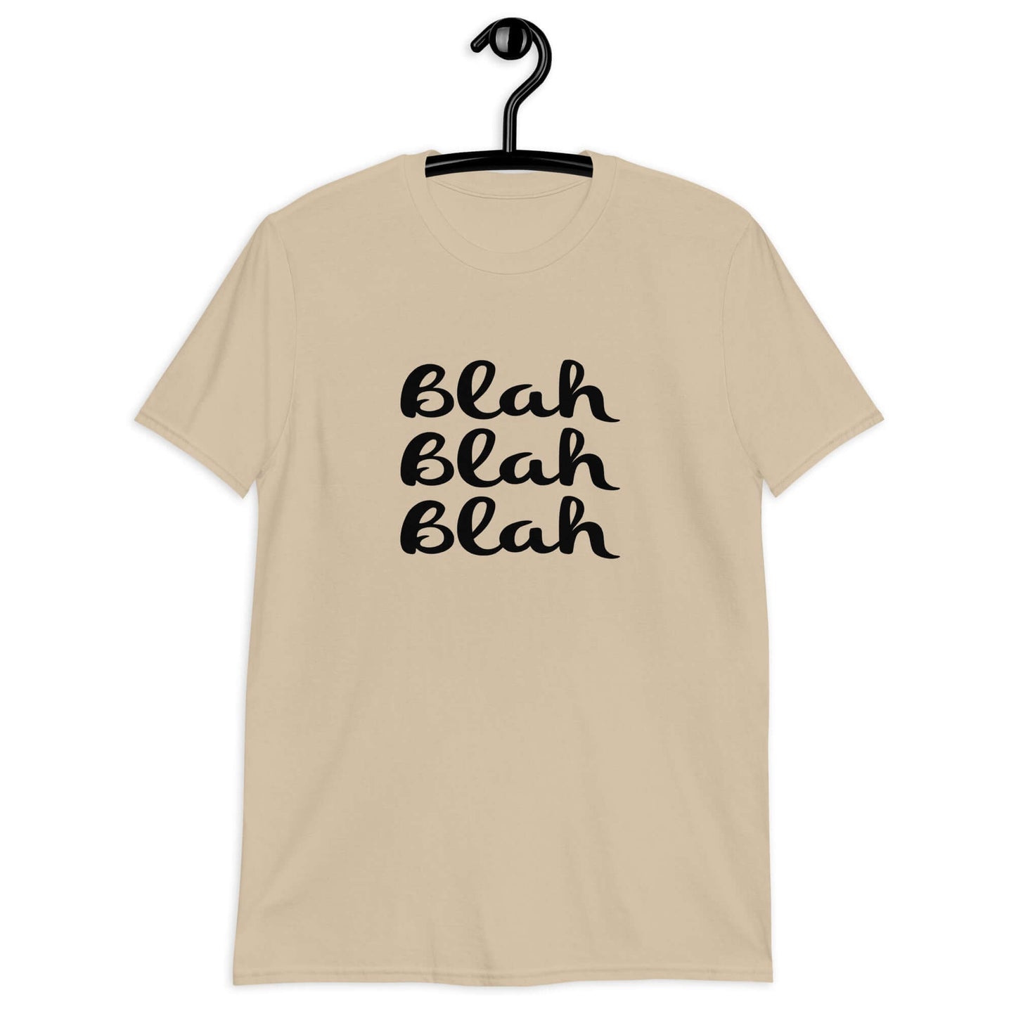 Sand t-shirt with the words Blah Blah Blah printed on the front.