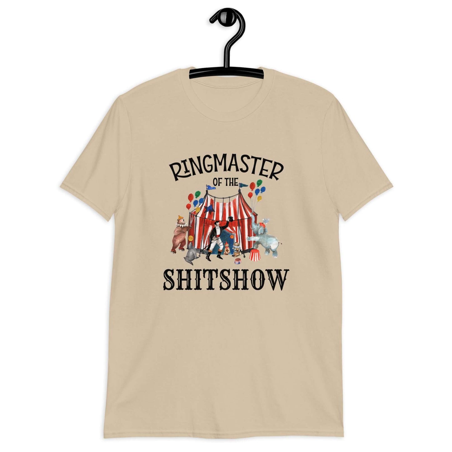 Sand t-shirt with a circus theme graphic and the words Ringmaster of the Shitshow printed on the front.