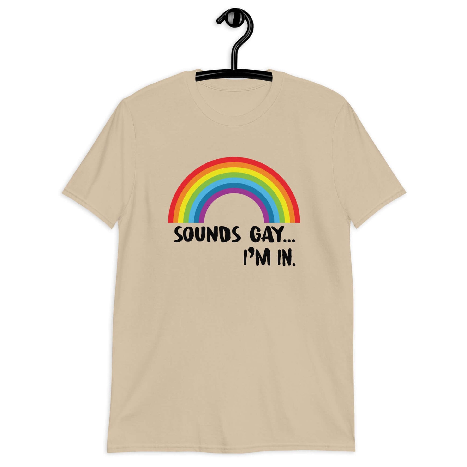 Sand t-shirt that has an image of a rainbow and the phrase Sounds gay, I'm in printed on the front