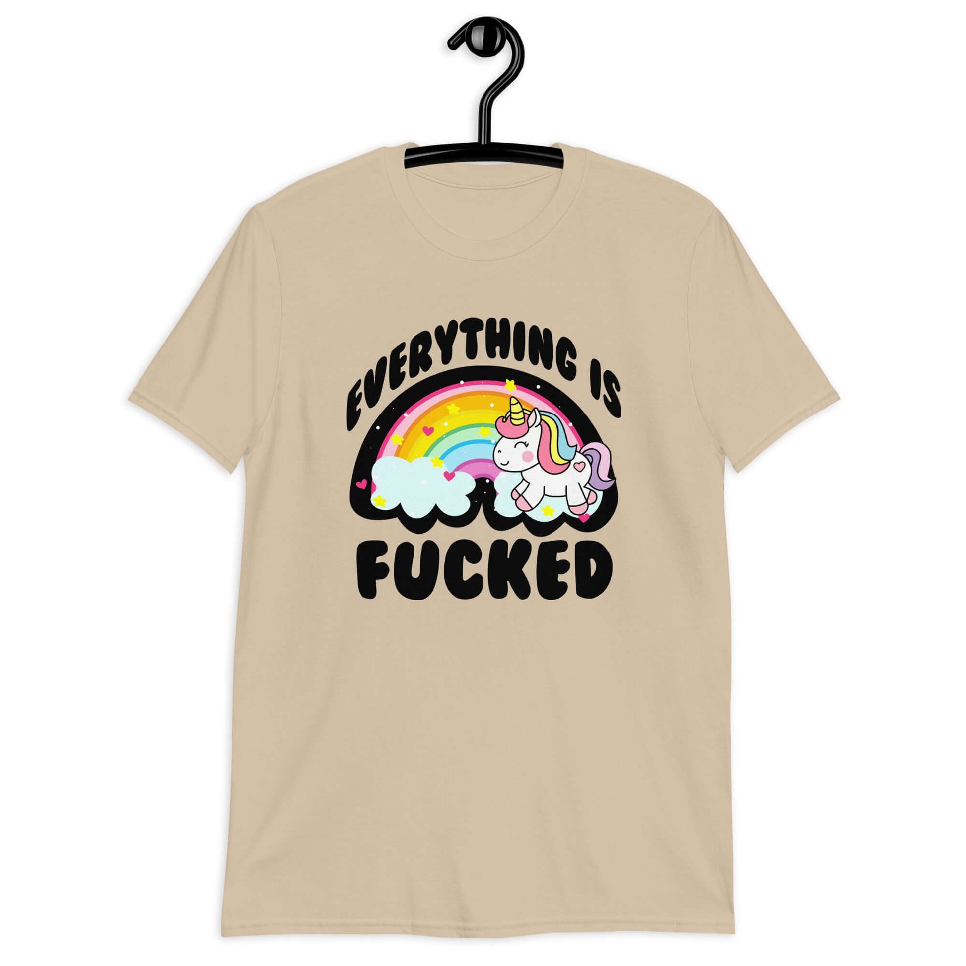 Sand t-shirt with a graphic of a kawaii style unicorn and a pastel rainbow with the words Everything is fucked printed on the front.