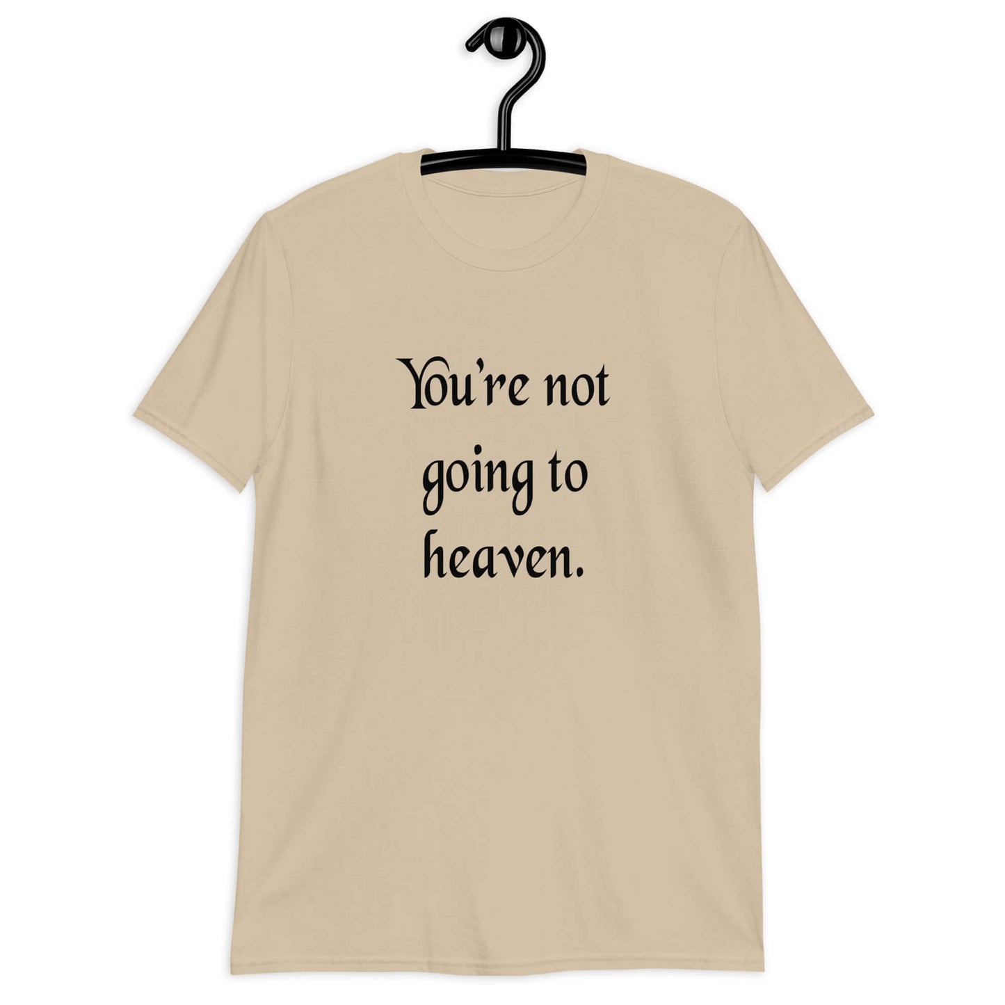 Sand t-shirt with the phrase You're not going to heaven printed on the front.