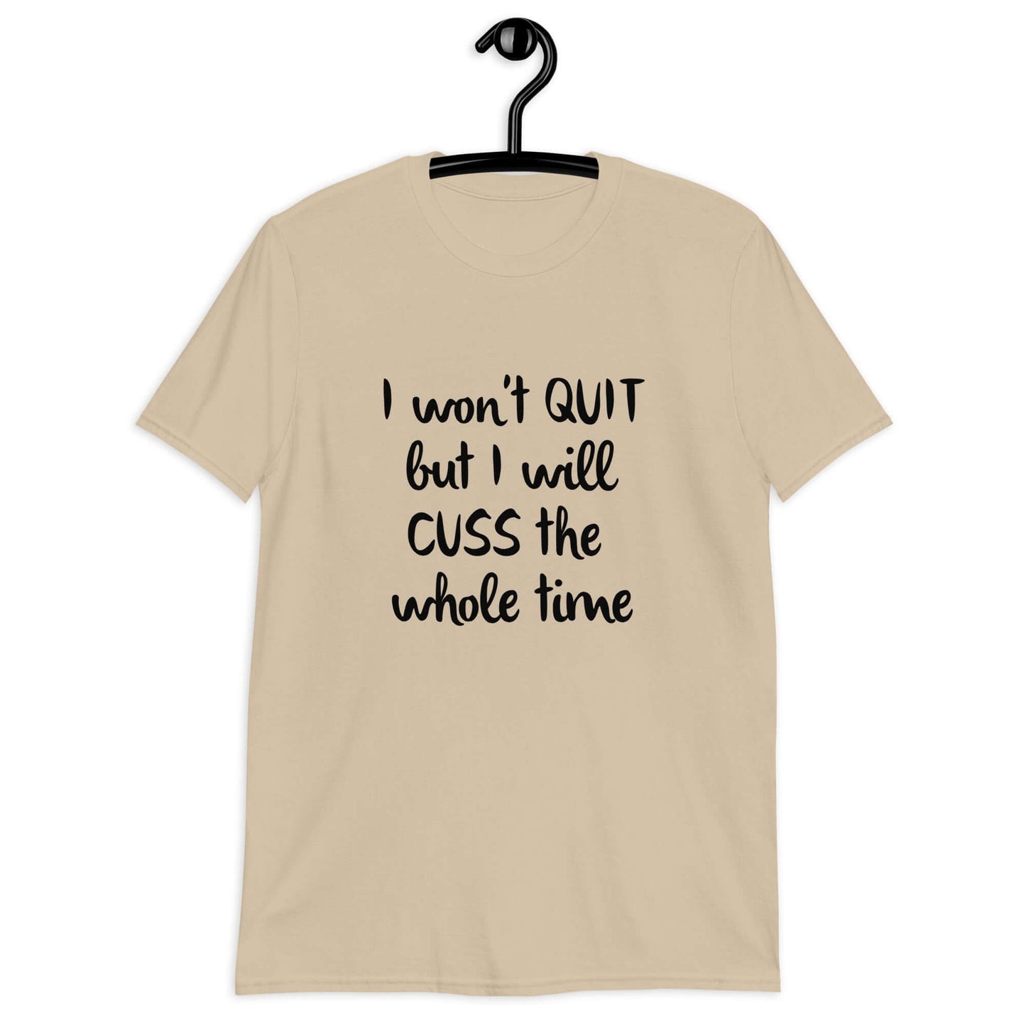 Sand t-shirt with the phrase I won't quit but I will cuss the whole time printed on the front.