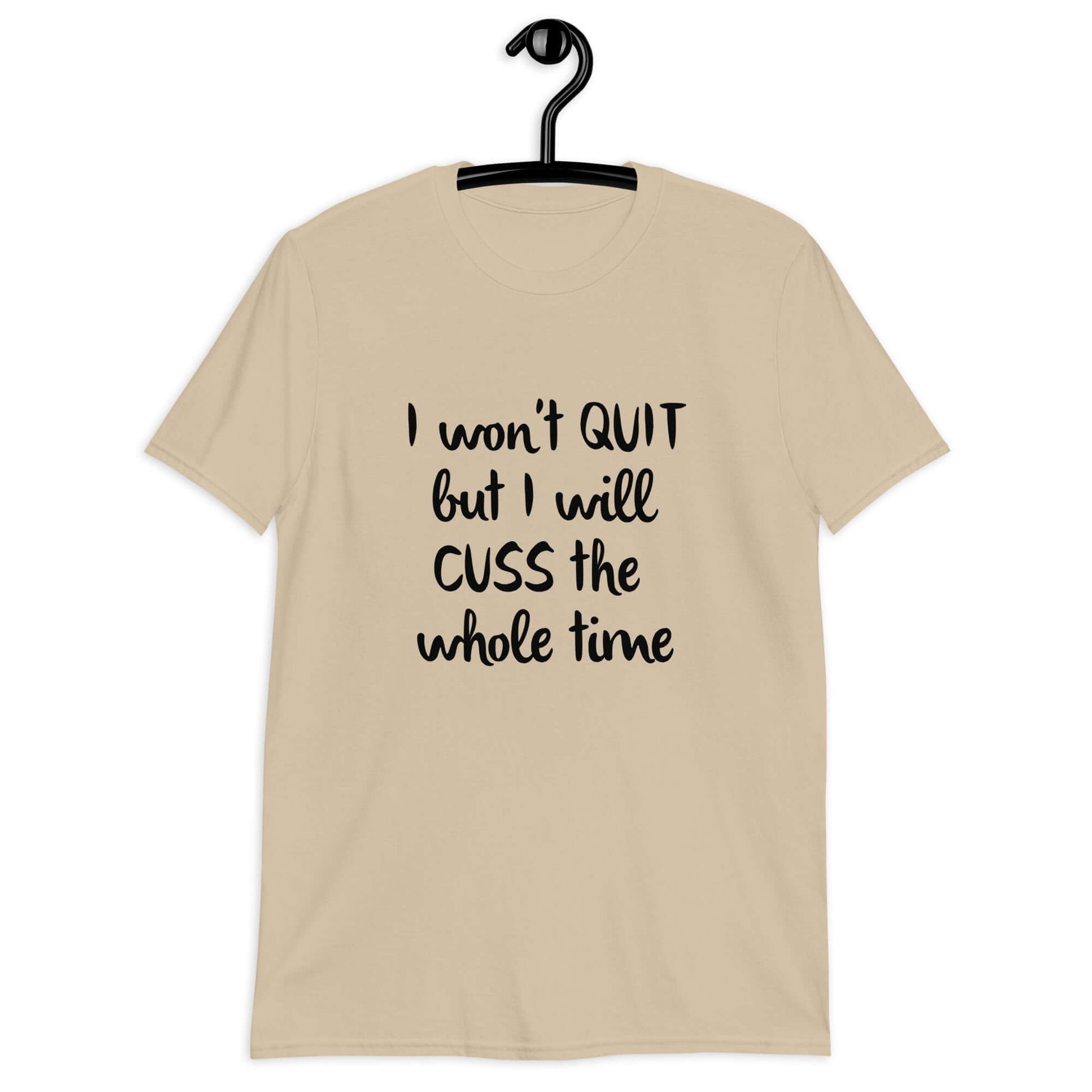 Sand t-shirt with the phrase I won't quit but I will cuss the whole time printed on the front.