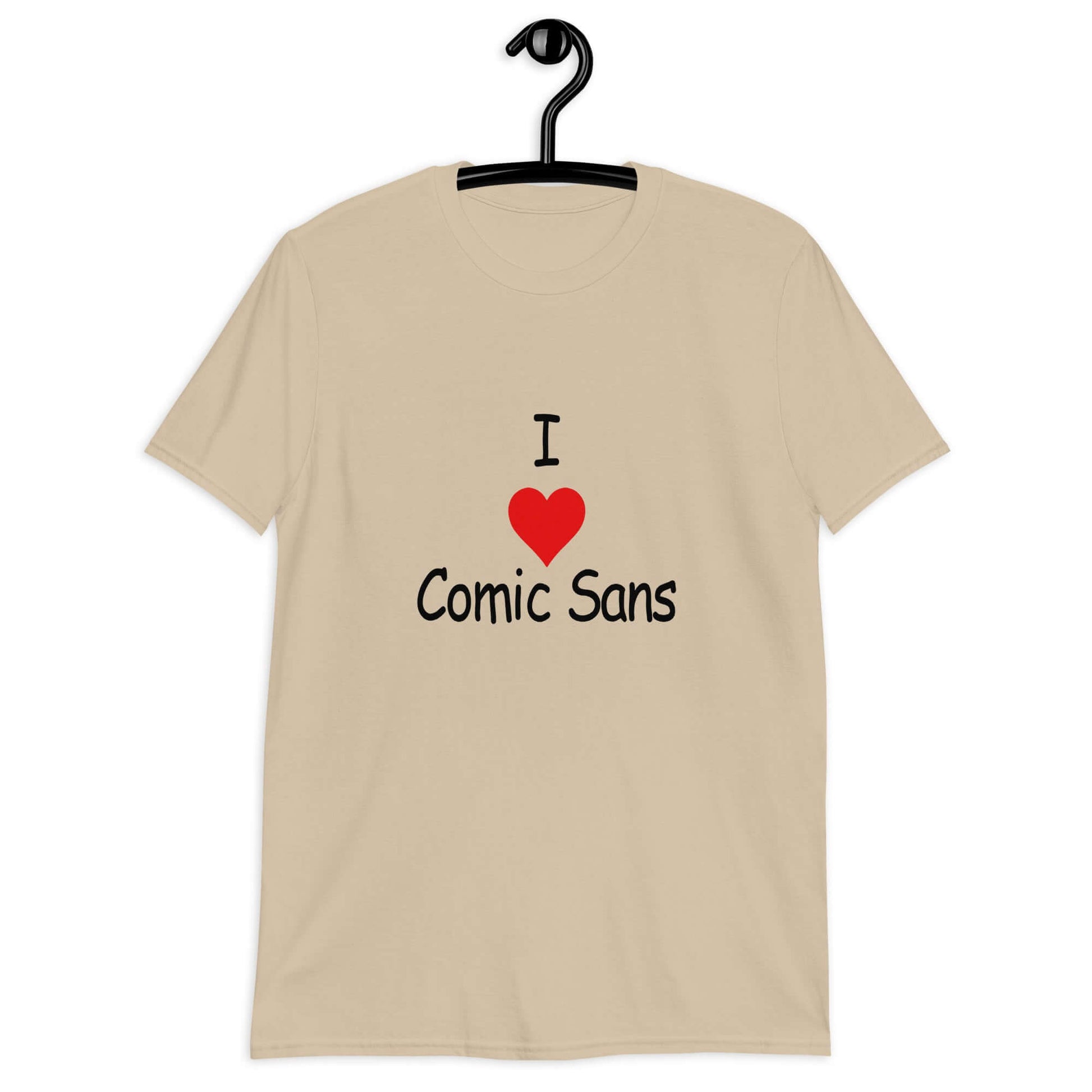 Sand color t-shirt with the phrase I heart Comic Sans on the front. The text is in comic sans font.