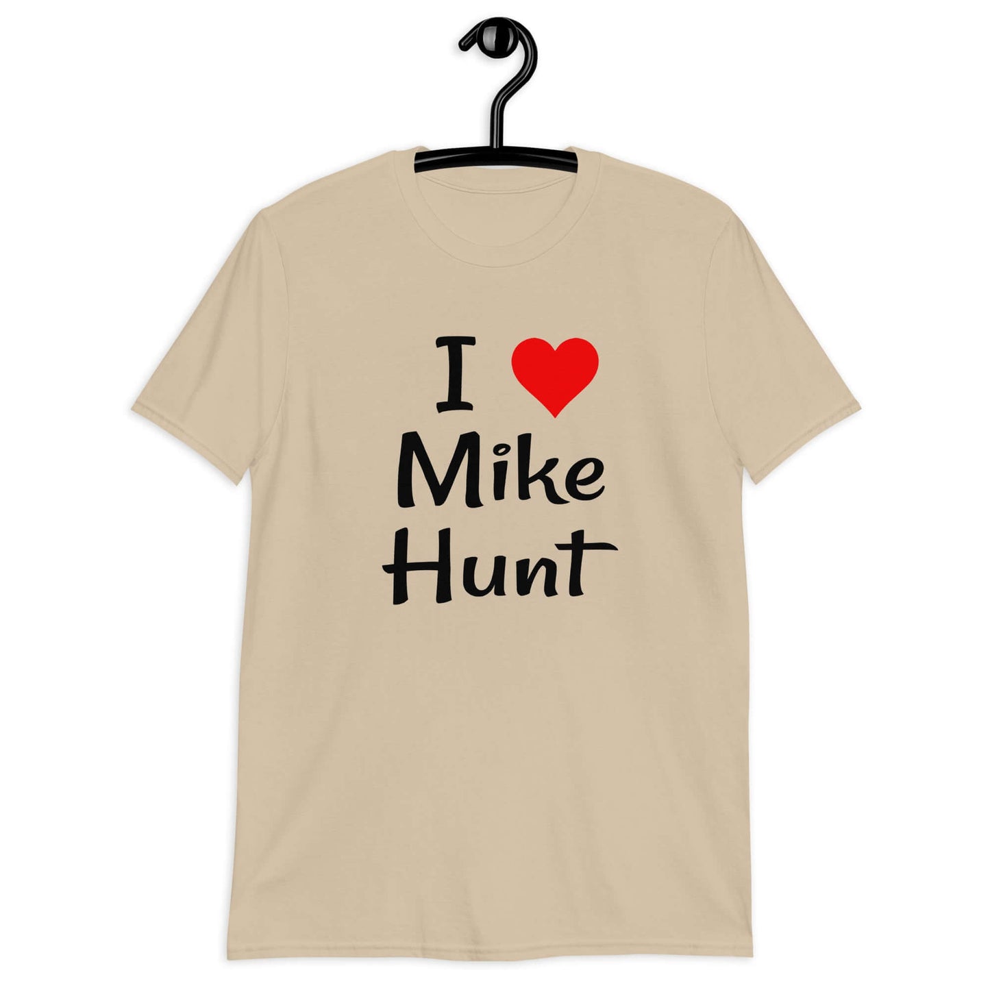 Sand color t-shirt with pun I heart Mike Hunt printed on the front. The heart is red.