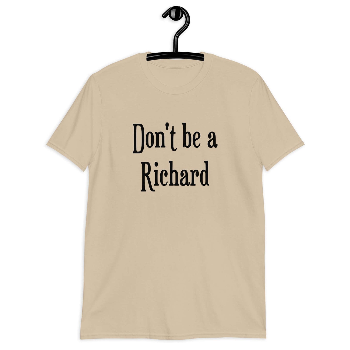 Sand color t-shirt with the phrase Don't be a Richard printed on the front.