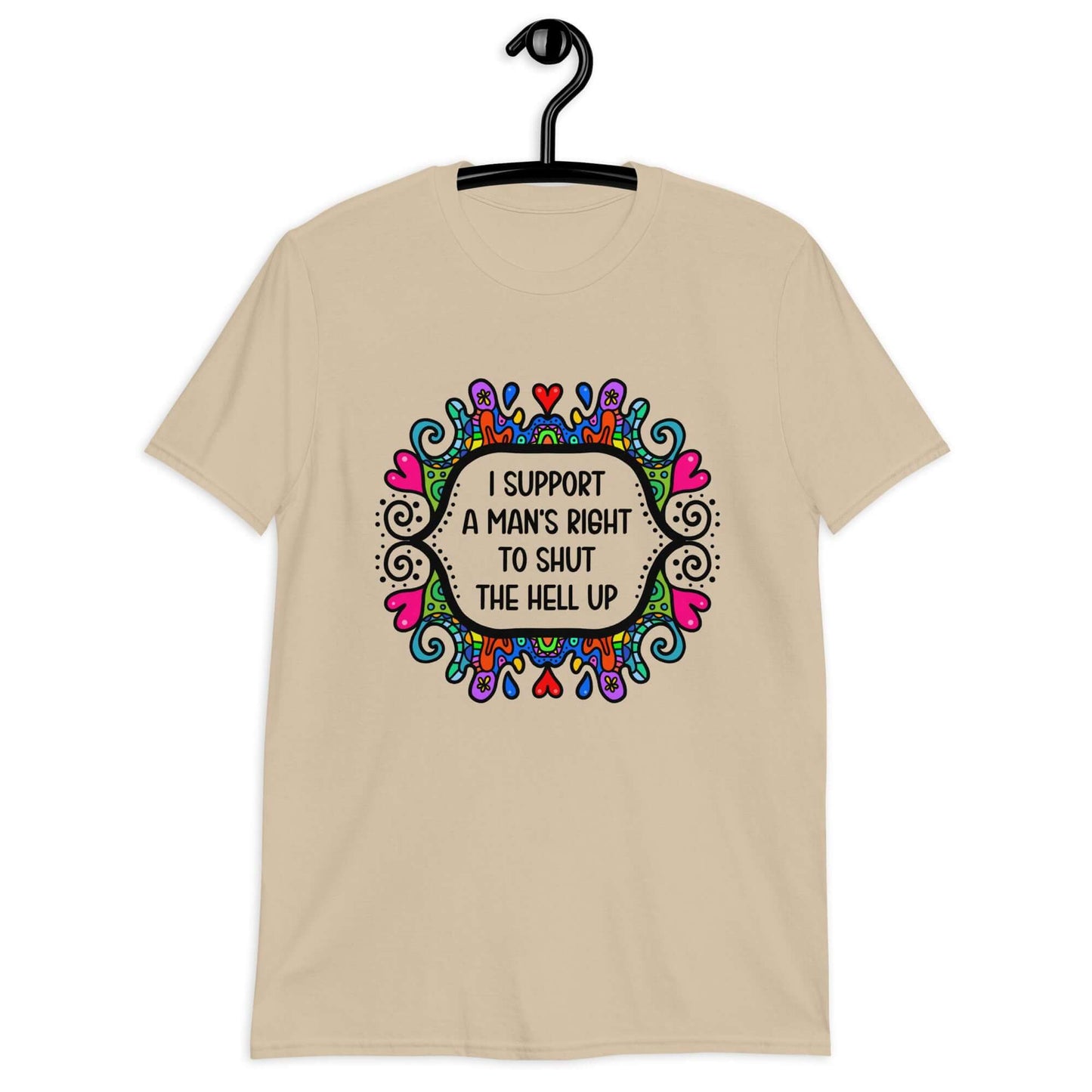 Sand color t-shirt with a colorful doodle graphic and the words I support a man's right to shut the hell up printed on the front.