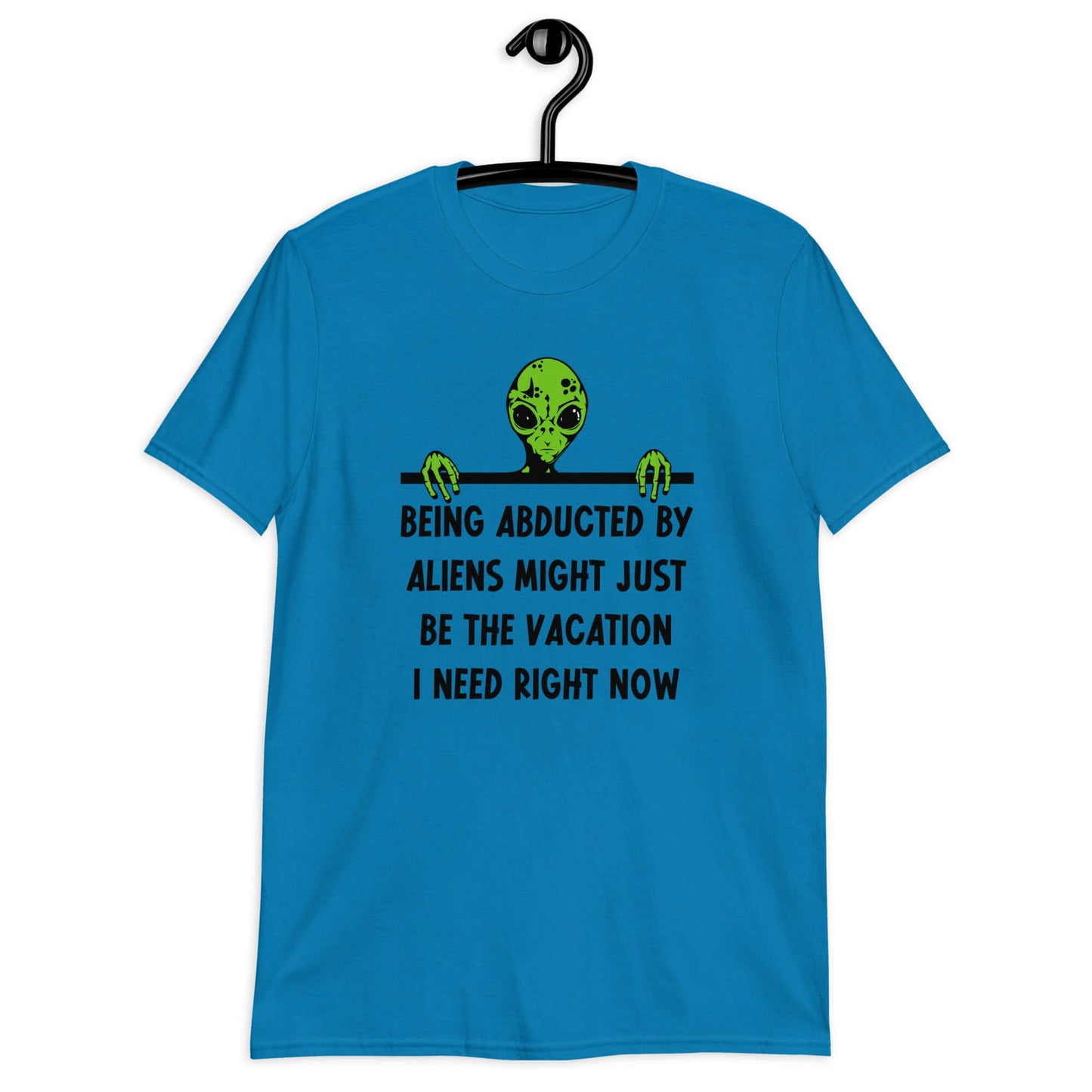 Sapphire blue t-shirt with an image of a green alien and the phrase Being abducted by aliens might just be the vacation I need right now printed on the front of the shirt.