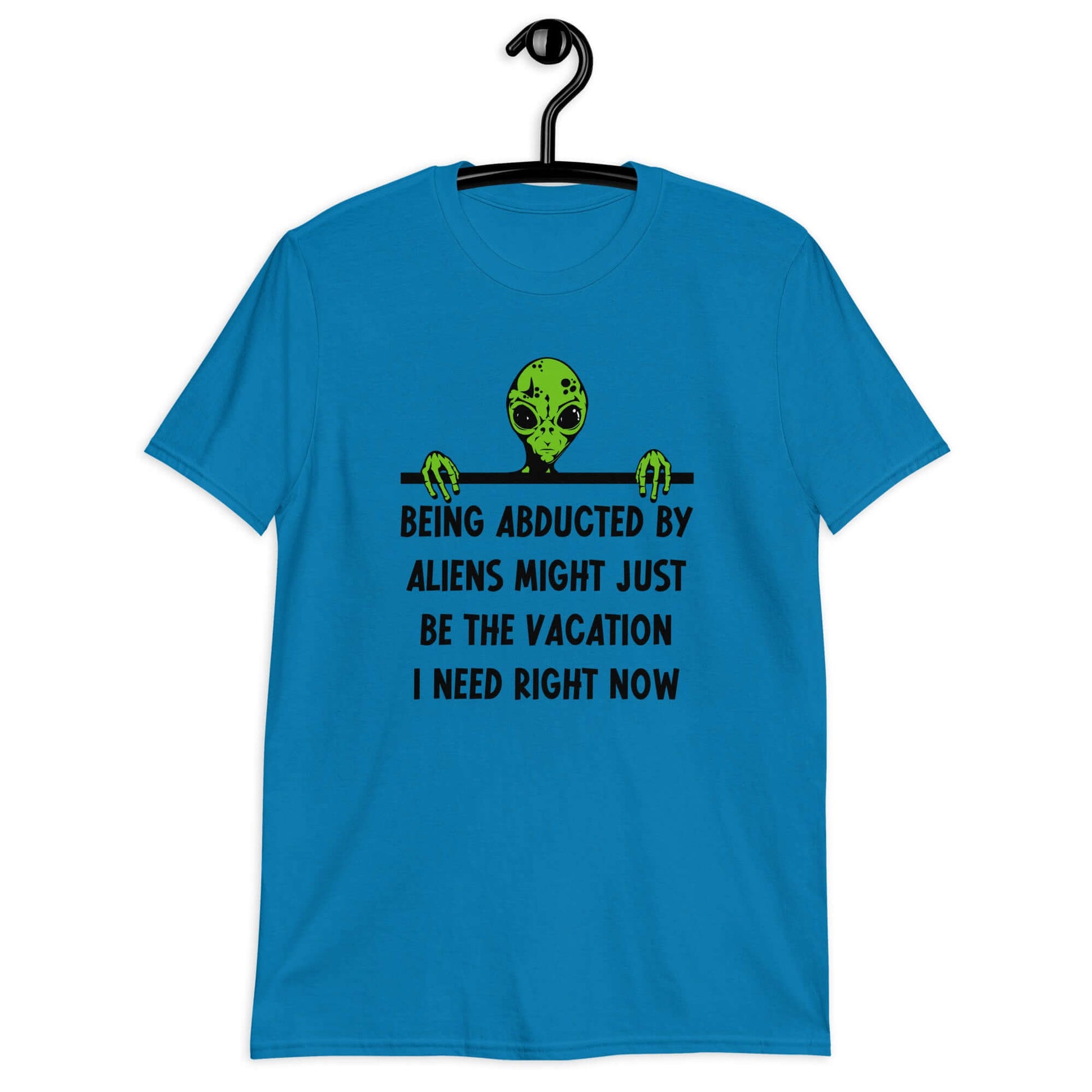 Sapphire blue t-shirt with an image of a green alien and the phrase Being abducted by aliens might just be the vacation I need right now printed on the front of the shirt.