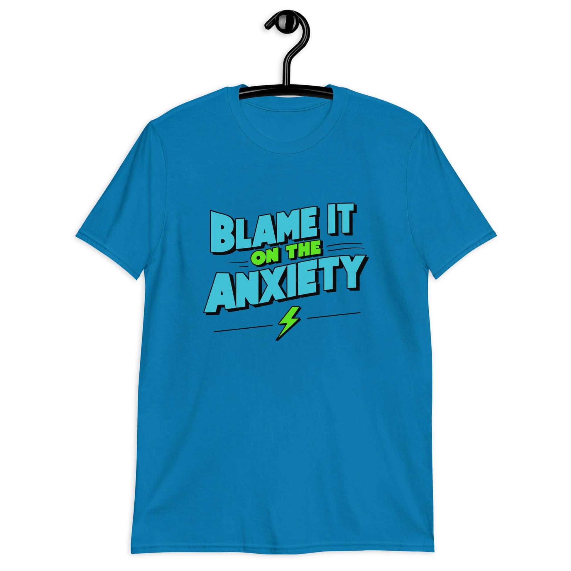 Sapphire blue t-shirt with the phrase Blame is on the anxiety printed on the front. The graphics are bold and in aqua and lime green.