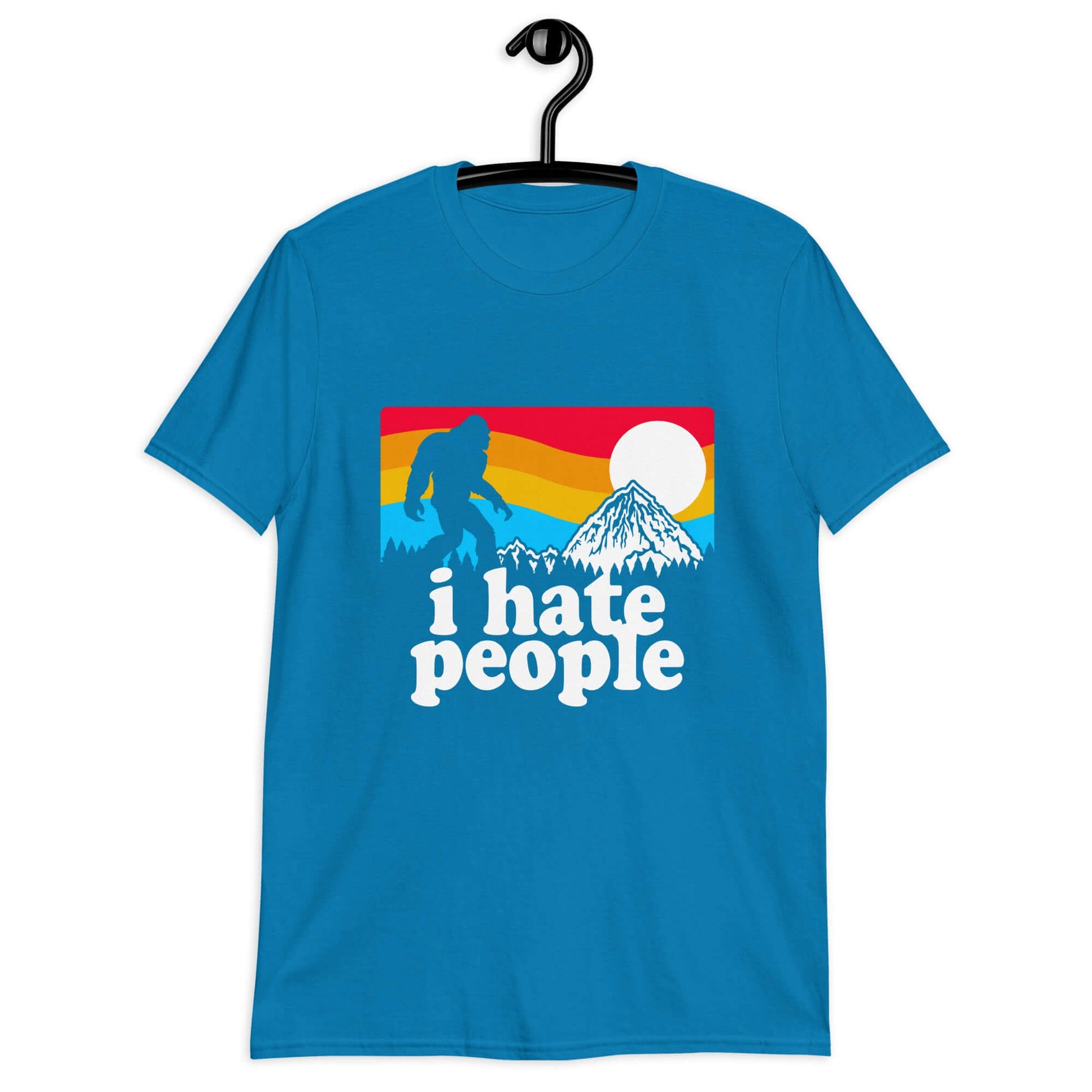 Sapphire blue t-shirt with a graphic of Bigfoot walking into the sunset with the words I hate people printed on the front.