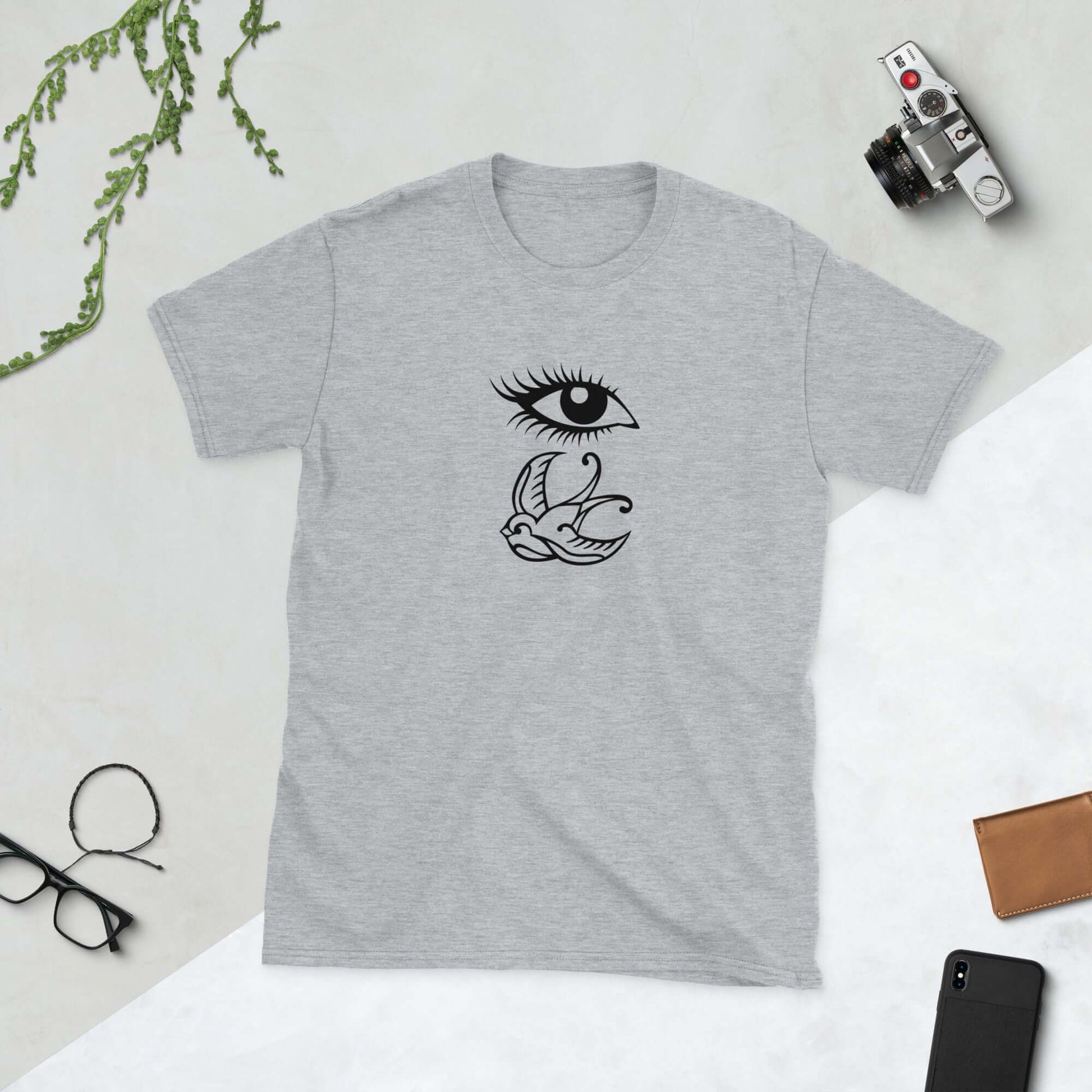 Sport grey t-shirt with outline drawing of an eye and a swallow bird printed on the front.