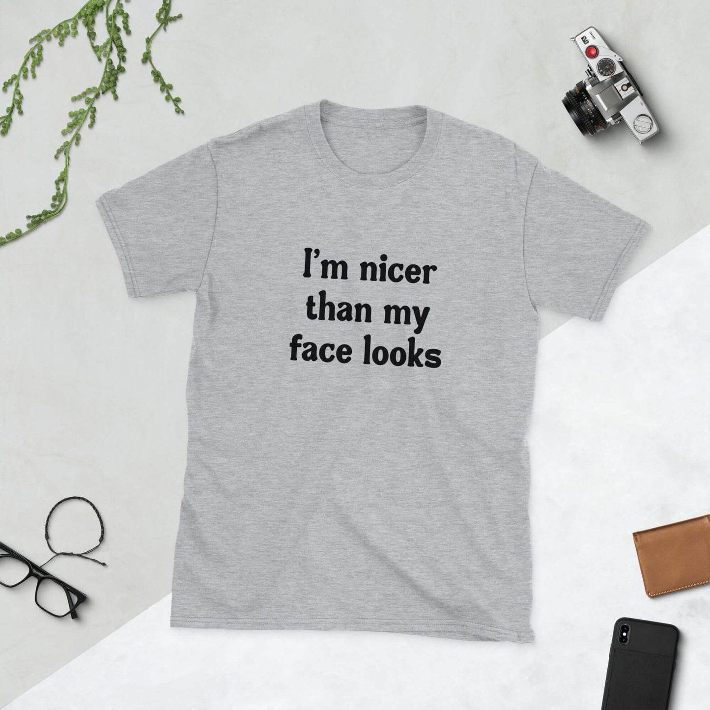 Sport grey t-shirt that says I'm nicer than my face looks printed on the front.