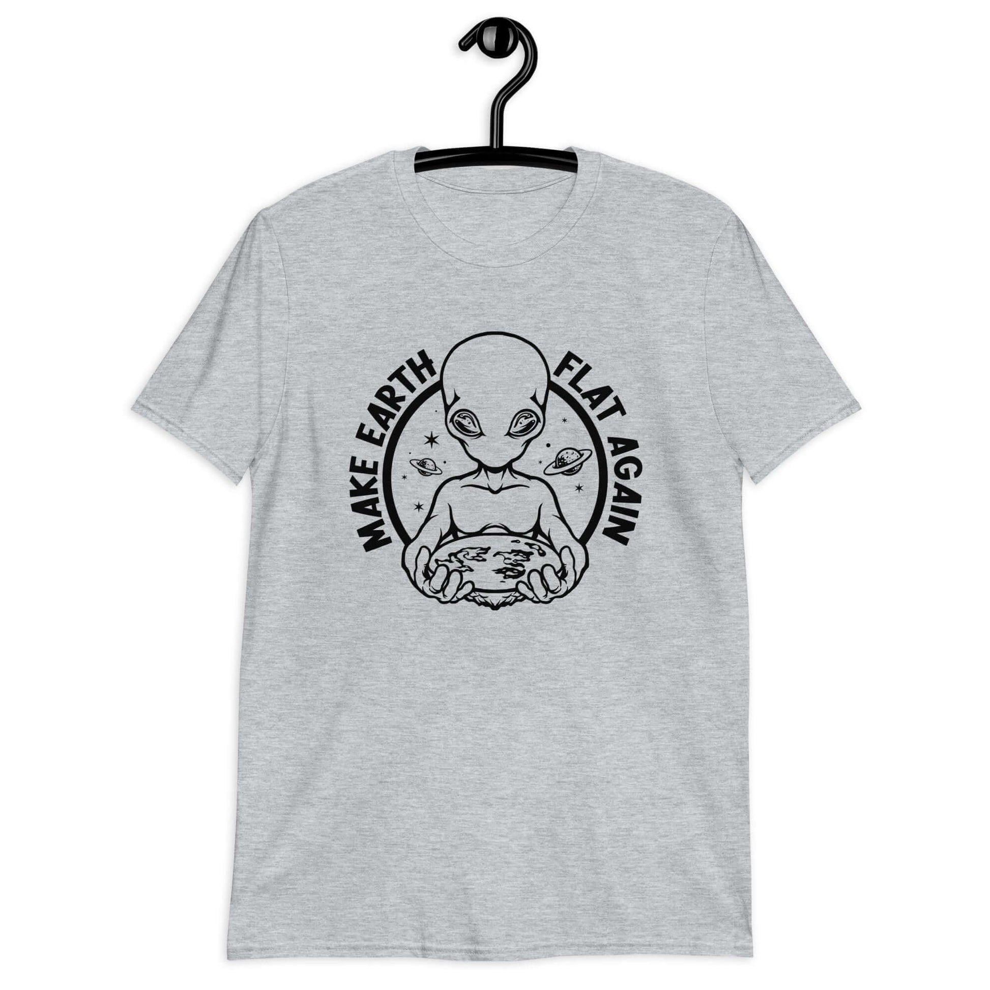 Light sport grey t-shirt with an image of an alien holding flat earth and the phrase Make earth flat again printed on the front.