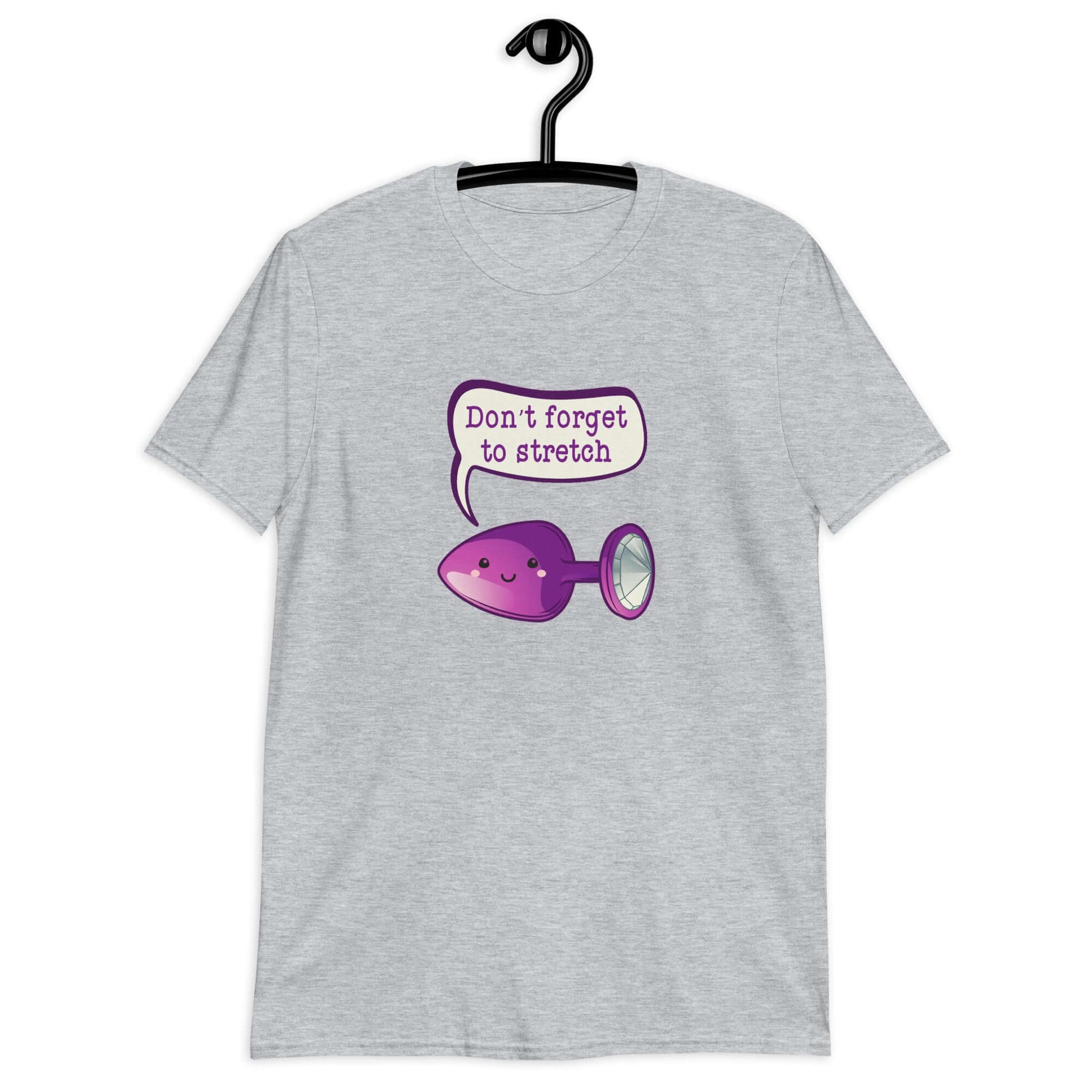 Sport grey t-shirt that has image of a purple anal plug with a smile face with a speech bubble above with the words Don't forget to stretch. The graphics are printed on the front of the shirt.