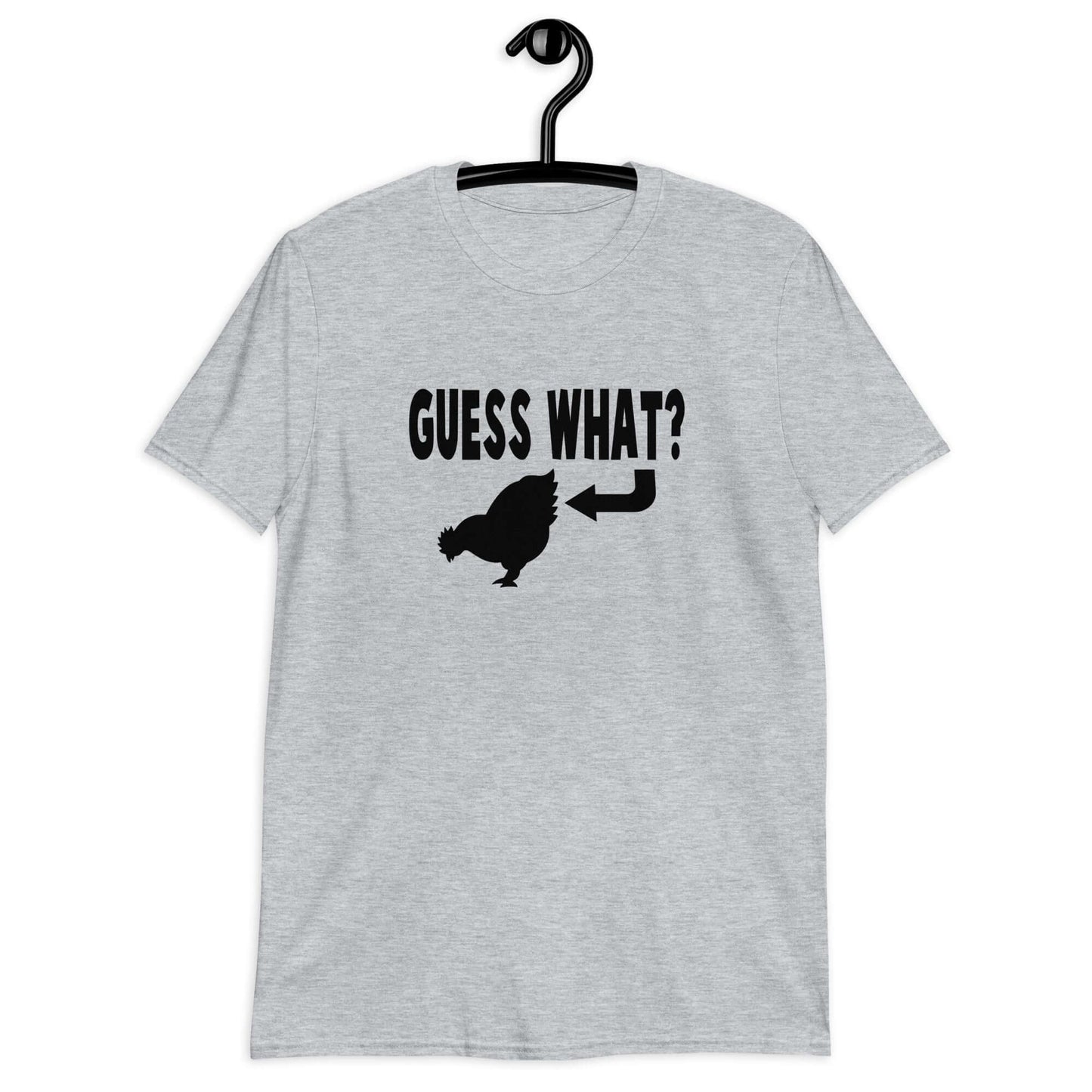 Sport grey t-shirt with an image of a chicken and the words Guess what question mark. There is an arrow pointing to the chickens butt. The graphics are printed on the front of the shirt.