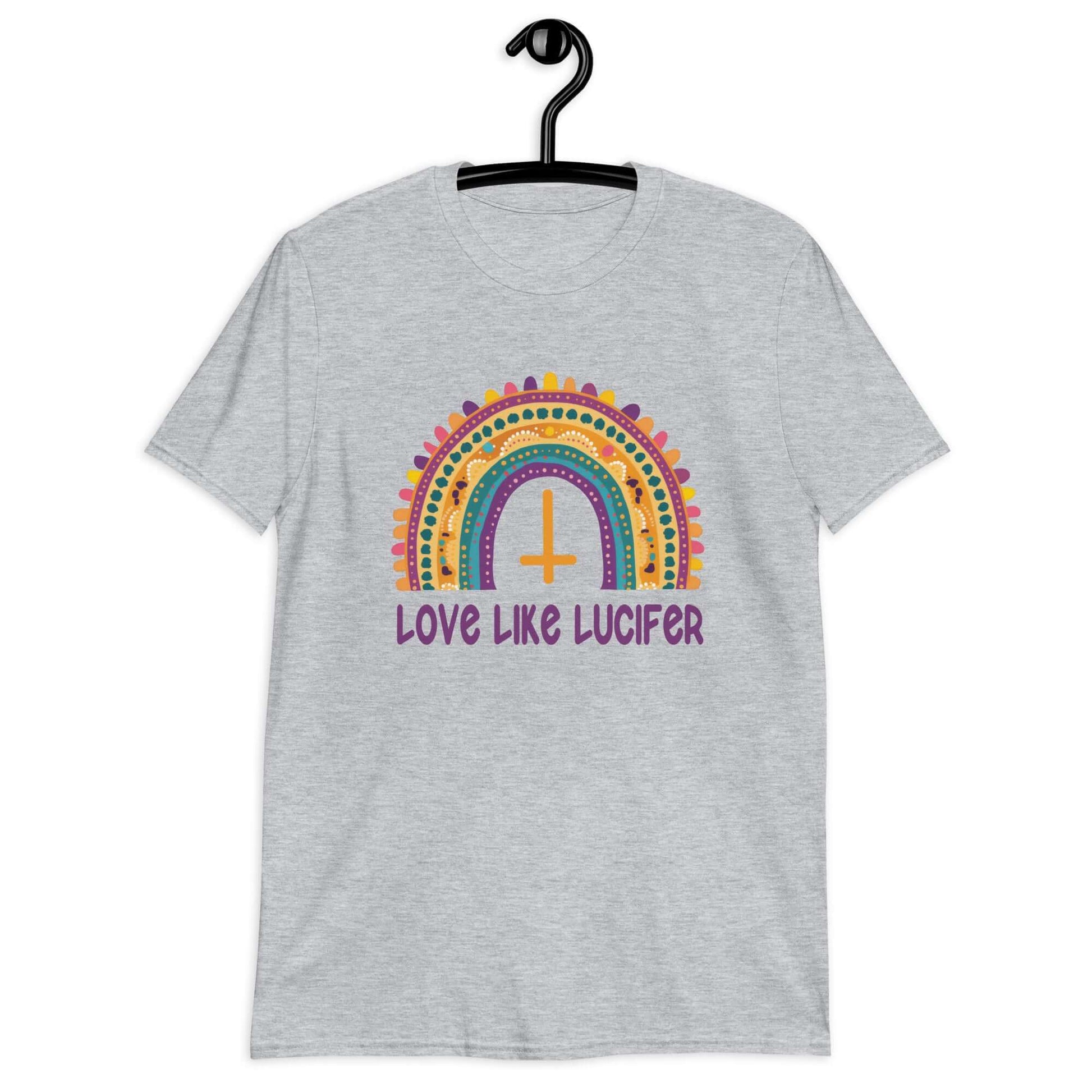 Sport grey t-shirt with an image of a boho style rainbow. There is an upside down cross in the center arch of the rainbow and the phrase Love like Lucifer printed under. The graphics are printed on the front.