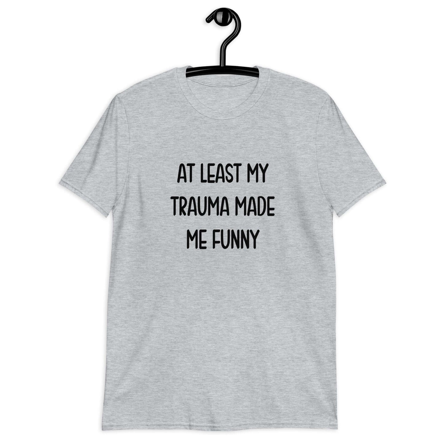 Sport grey t-shirt with the words At least my trauma made me funny printed on the front.