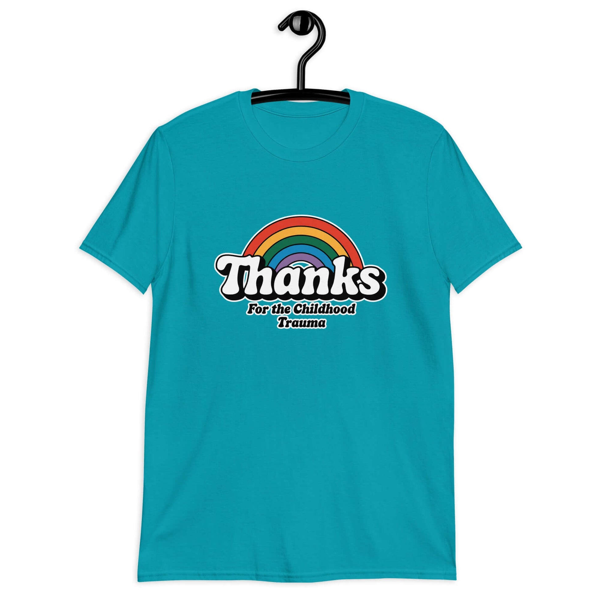 Tropical blue t-shirt with an image of a rainbow and the words Thanks for the childhood trauma printed on the front. The word Thanks is large and the rest of the words are smaller under.