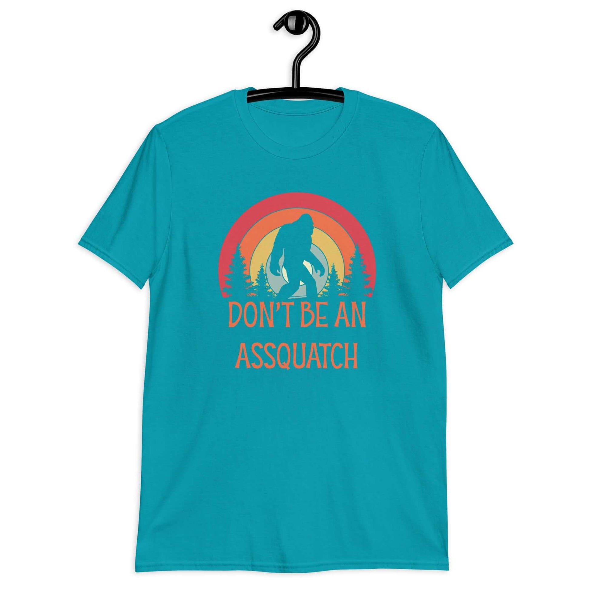 Tropical blue t-shirt with sasquatch graphic and the words don't be an assquatch printed on the front.