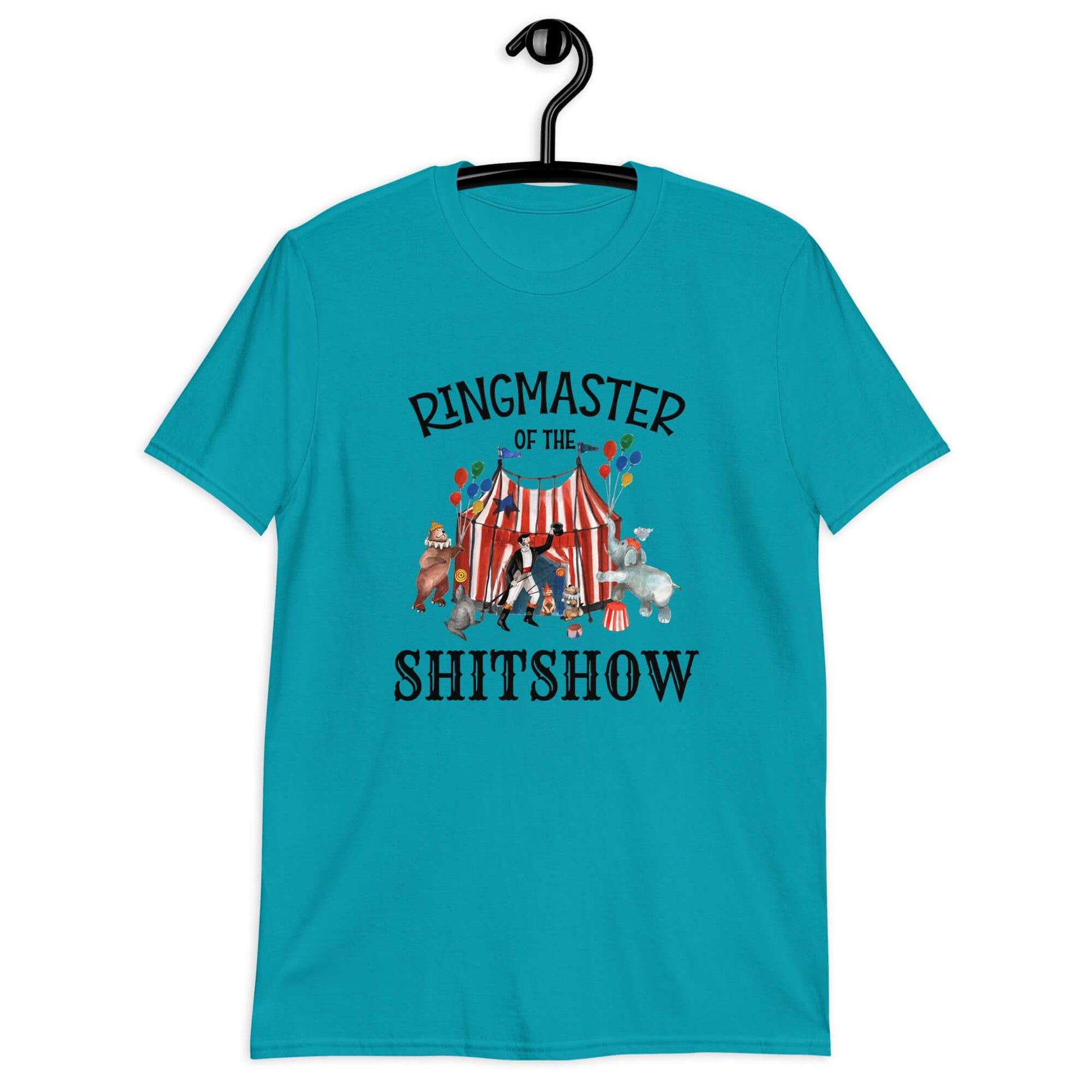 Tropical blue t-shirt with a circus theme graphic and the words Ringmaster of the Shitshow printed on the front.