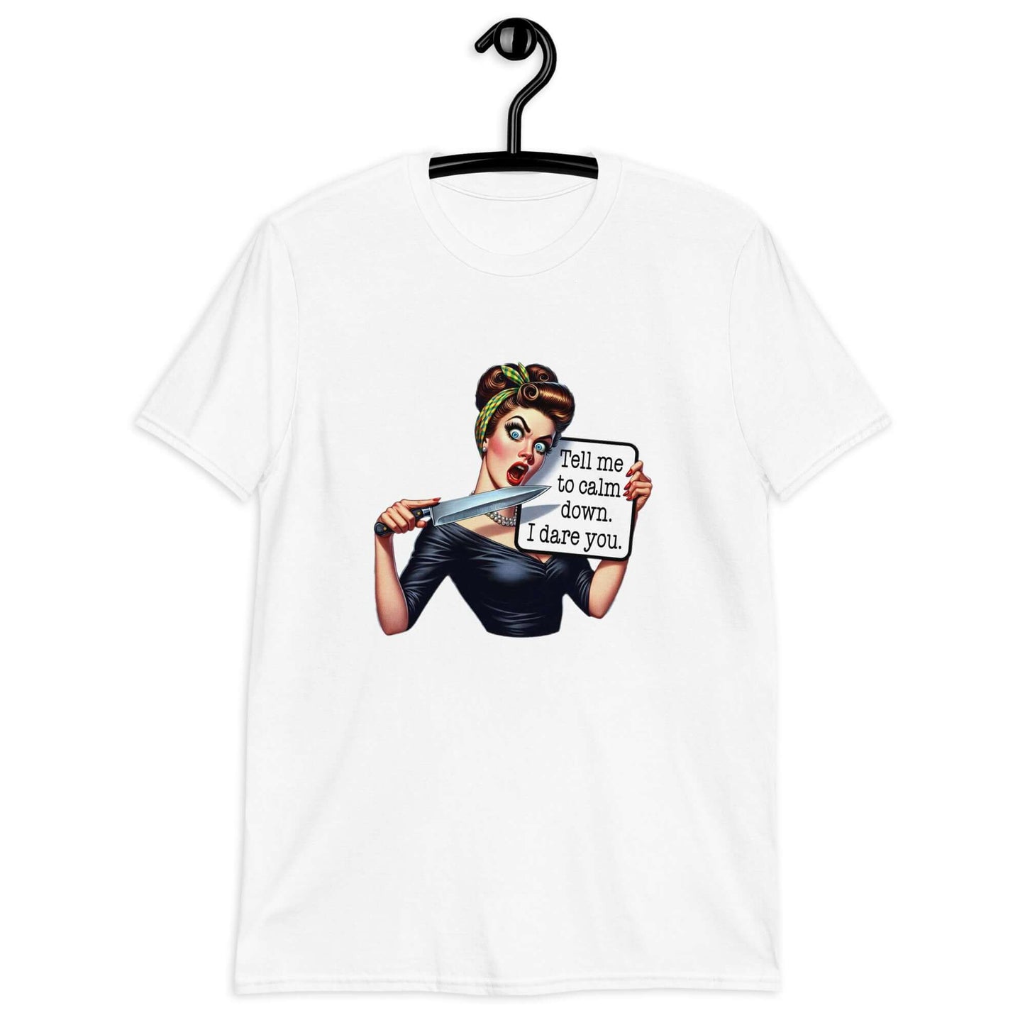 White t-shirt displayed on a hanger. The t-shirt has a graphic of an angry looking retro woman holding a knife and a sign. The sign says Tell me to calm down I dare you. The graphic is printed on the front of the shirt.