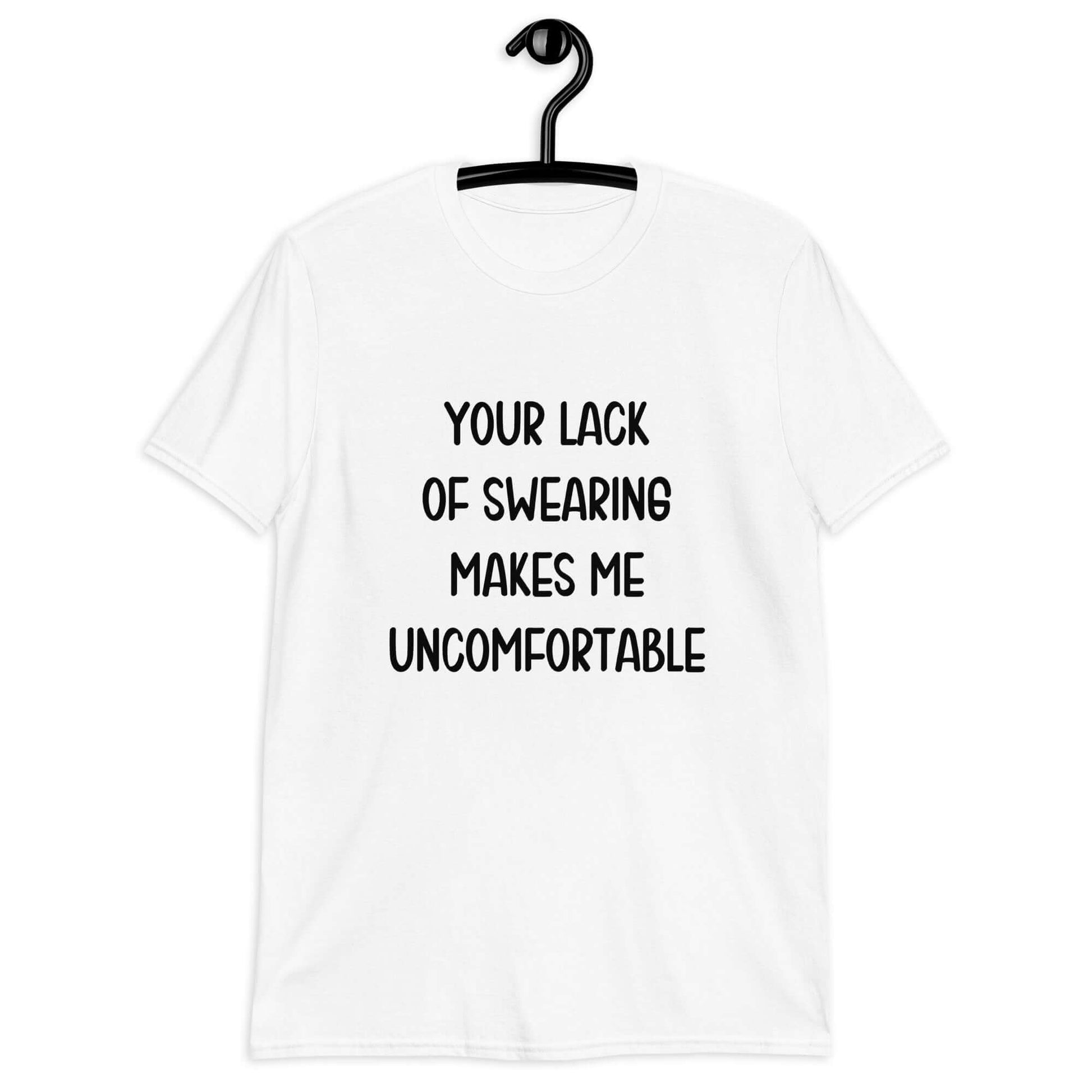 White t-shirt with the phrase Your lack of swearing makes me uncomfortable printed on the front.