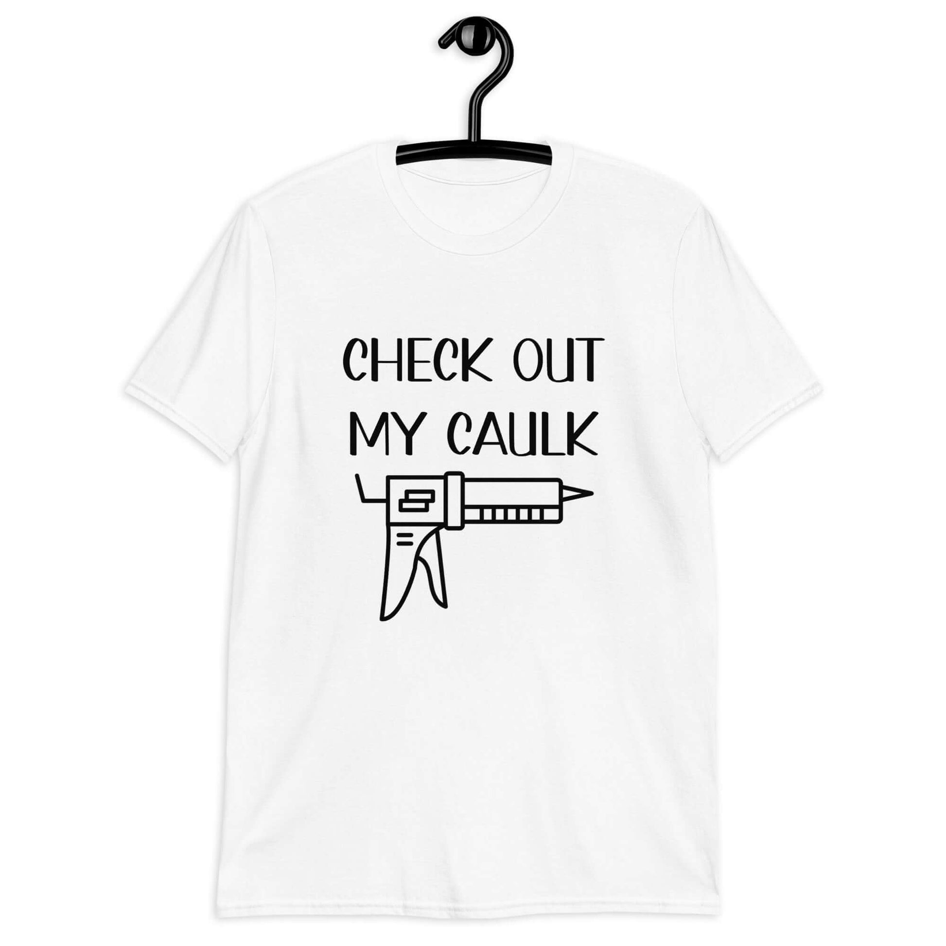 White t-shirt with the pun phrase Check out my caulk with a line drawing image of a caulking gun printed on the front.