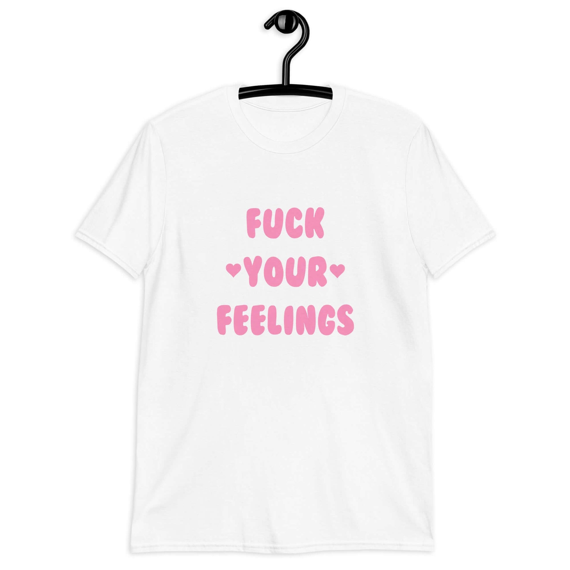 White t-shirt with the words Fuck your feelings printed on the front in pink. There are cute pink hearts next to the words.
