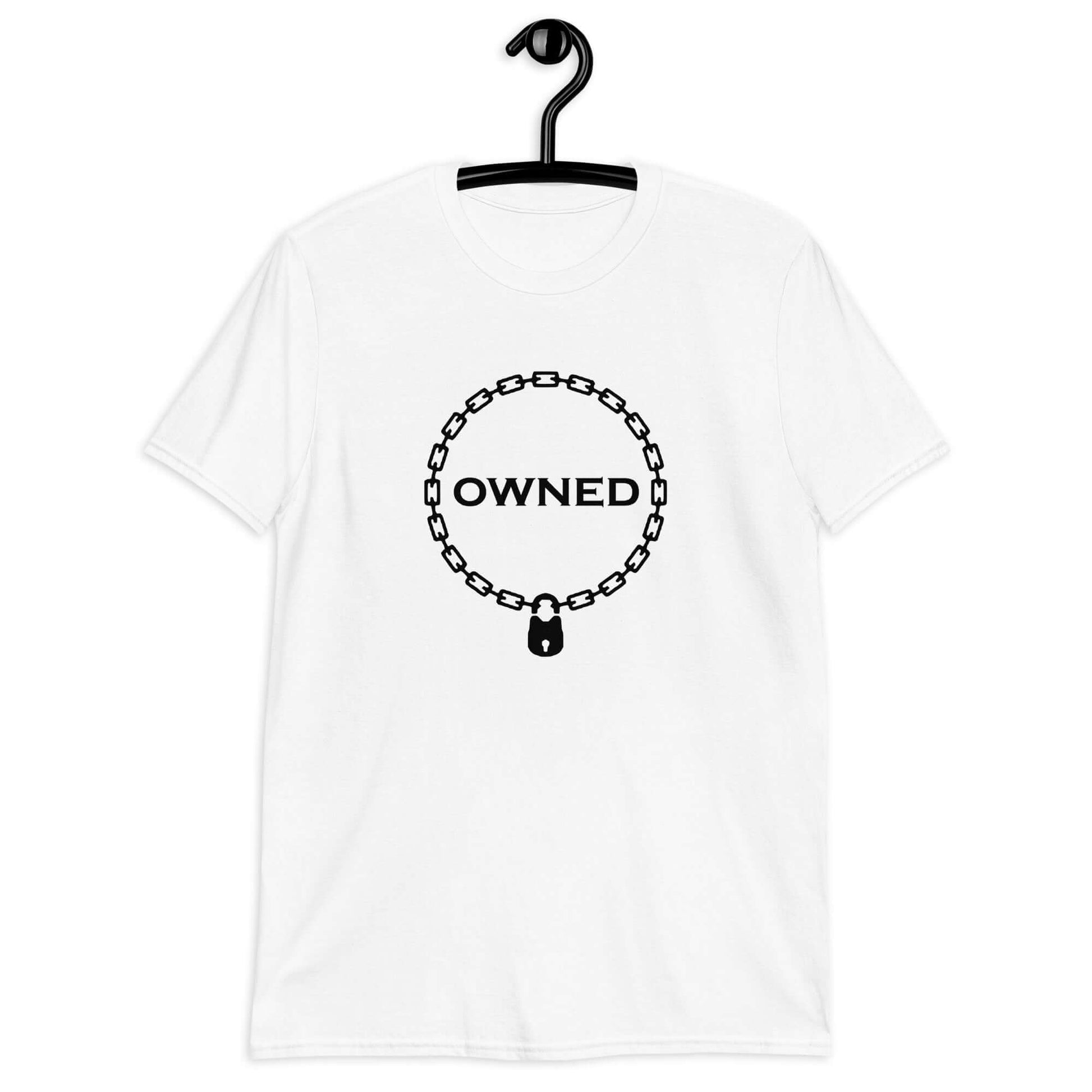 White t-shirt with an image of a BDSM chain collar with a lock and the word Owned printed in the center of the collar. The design is printed on the front of the shirt.