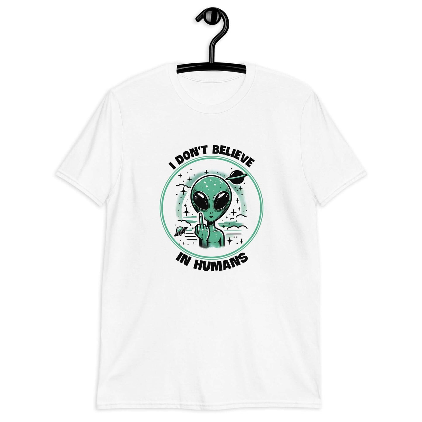 White t-shirt with an image of an alien flipping the middle finger. The words I don't believe in humans are printed around the image. The graphics are printed on the front of the shirt.