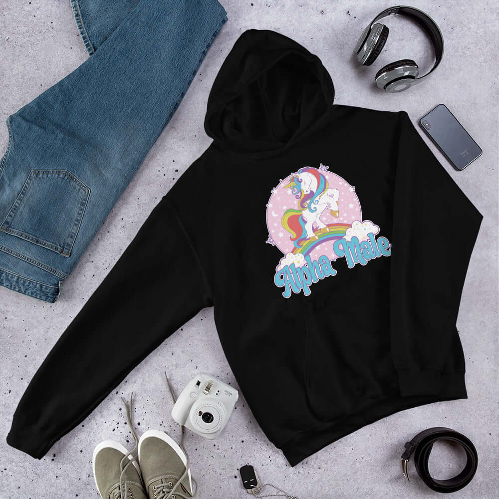 Black hoodie sweatshirt with funny pastel rainbow unicorn graphics and the words Alpha Male printed on the front.