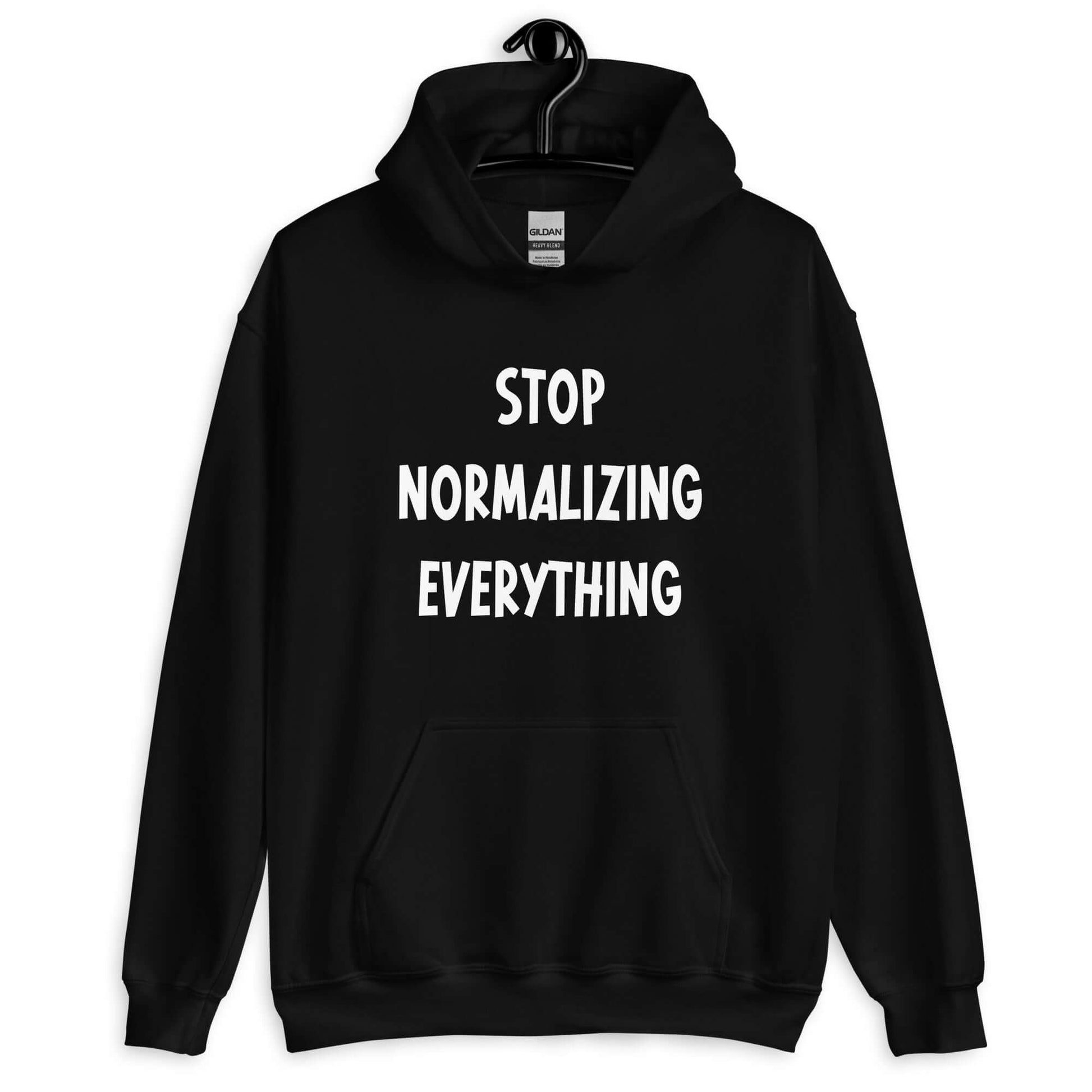 Black hoodie sweatshirt with stop normalizing everything printed on the front.