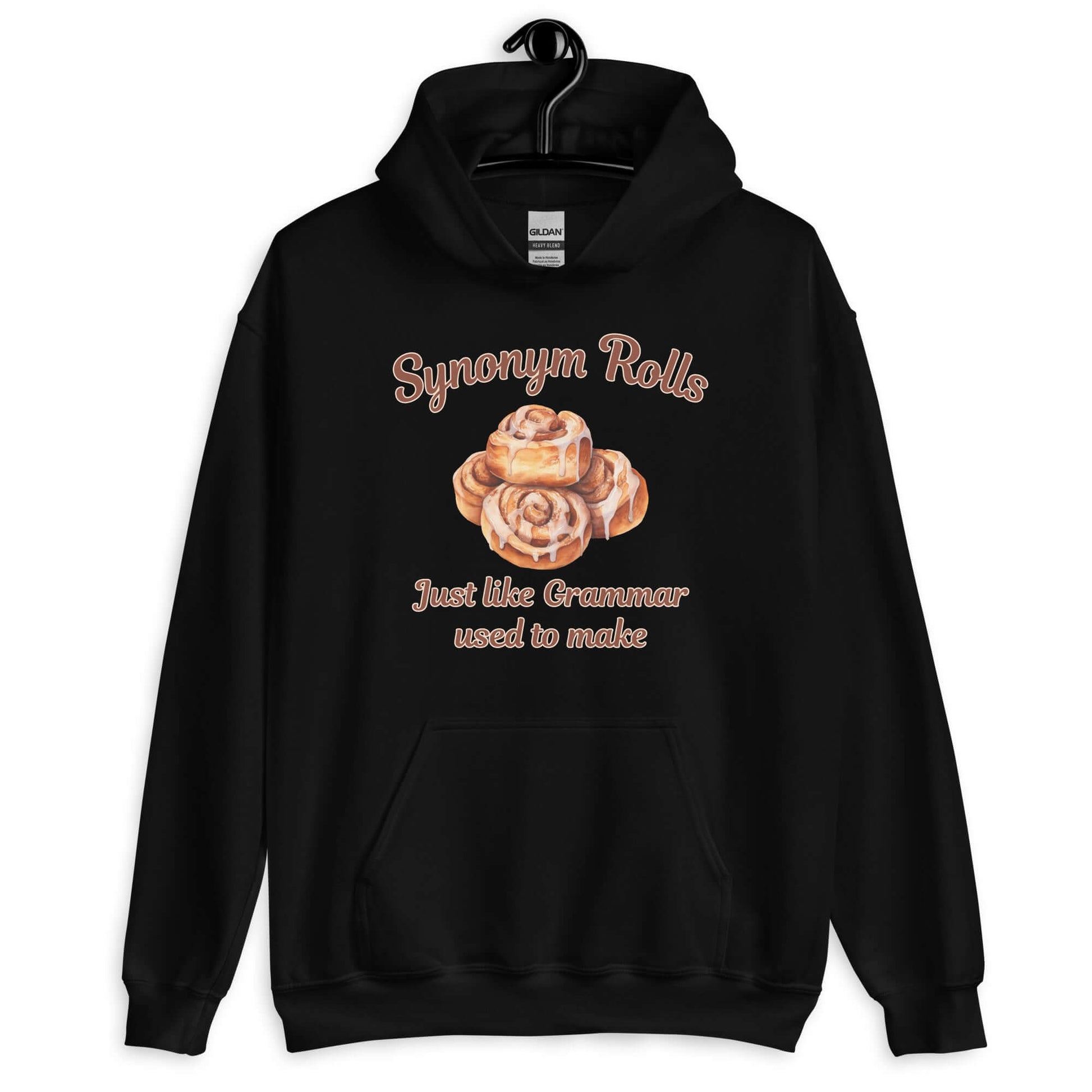 Black hoodie sweatshirt with an image of cinnamon rolls and the pun phrase Synonym rolls Just like Grammar used to make printed on the front.