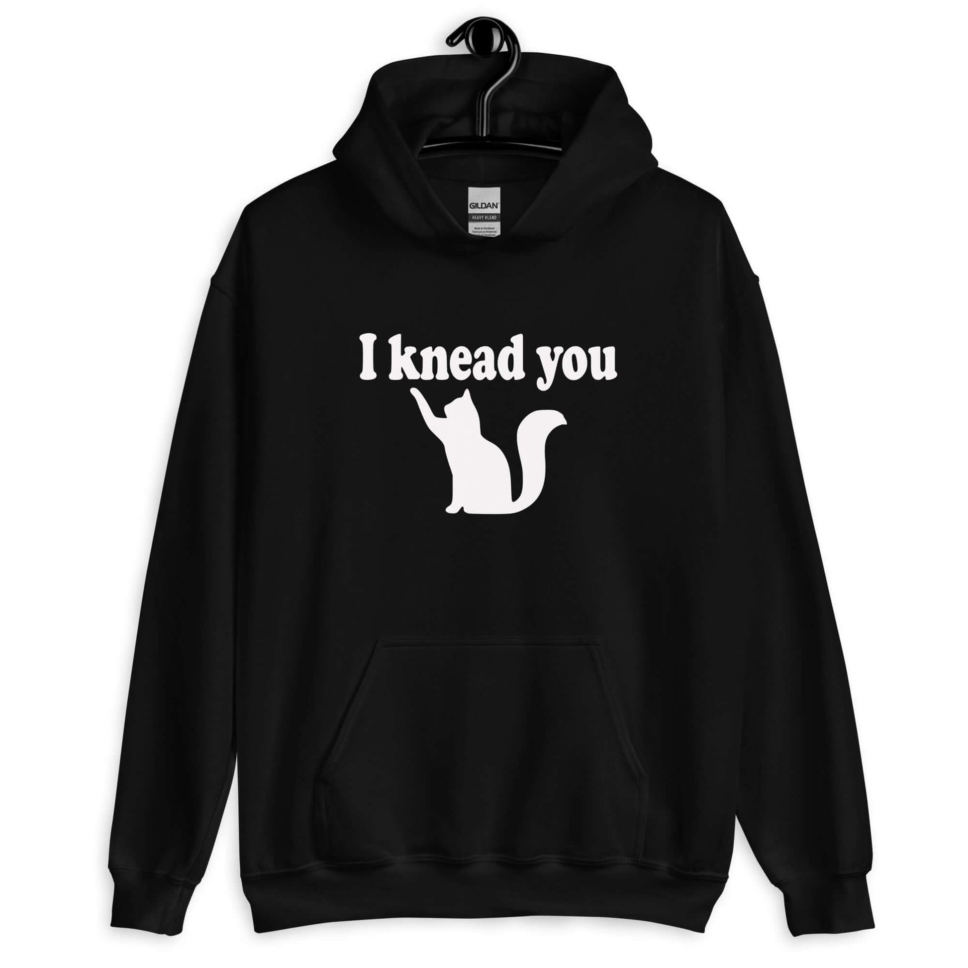 Black hoodie sweatshirt that has an image of a silhouette of a cat and the words I knead you printed on the front.