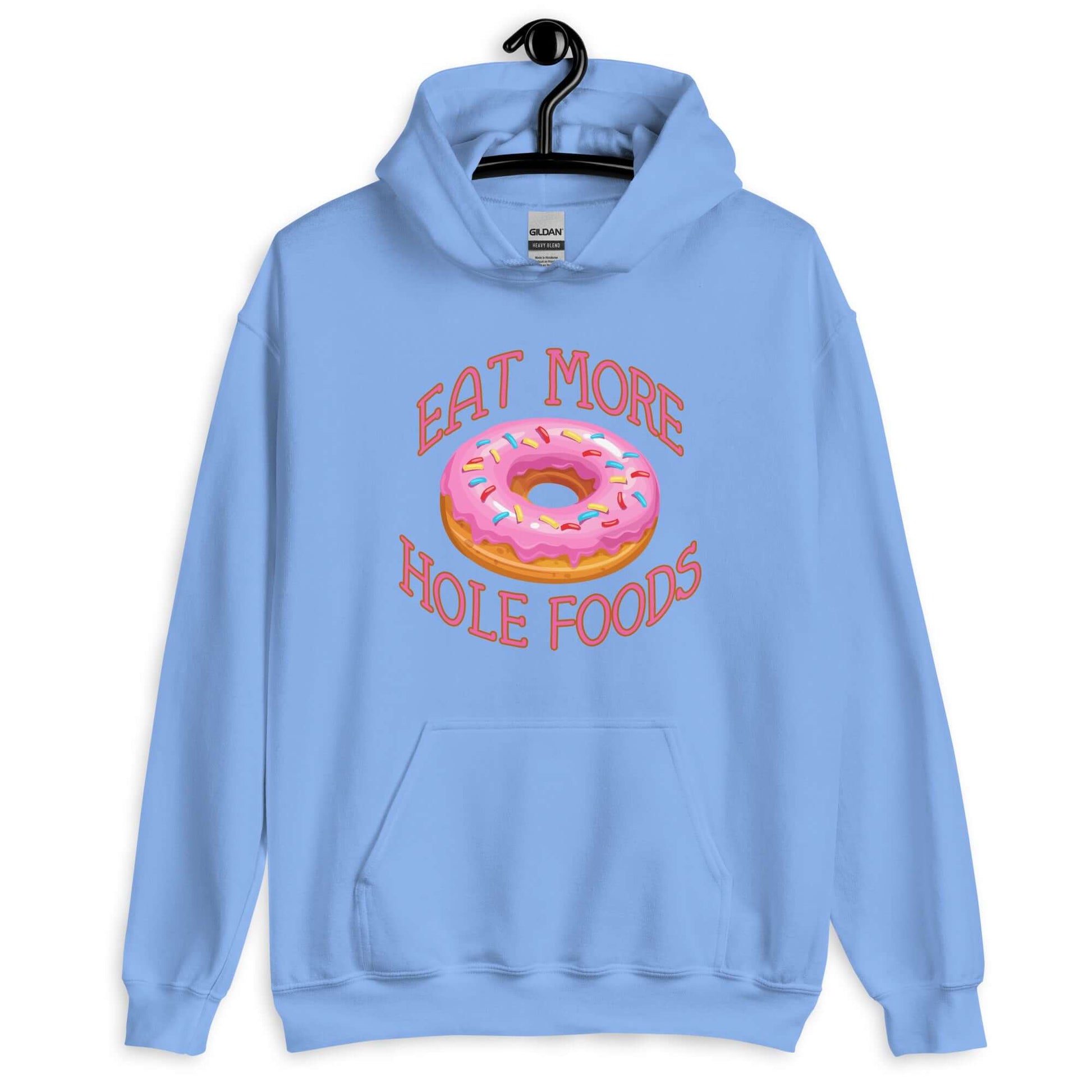Carolina blue hoodie sweatshirt with an image of a donut with pink icing and sprinkles and the words Eat more hole foods printed on the front.