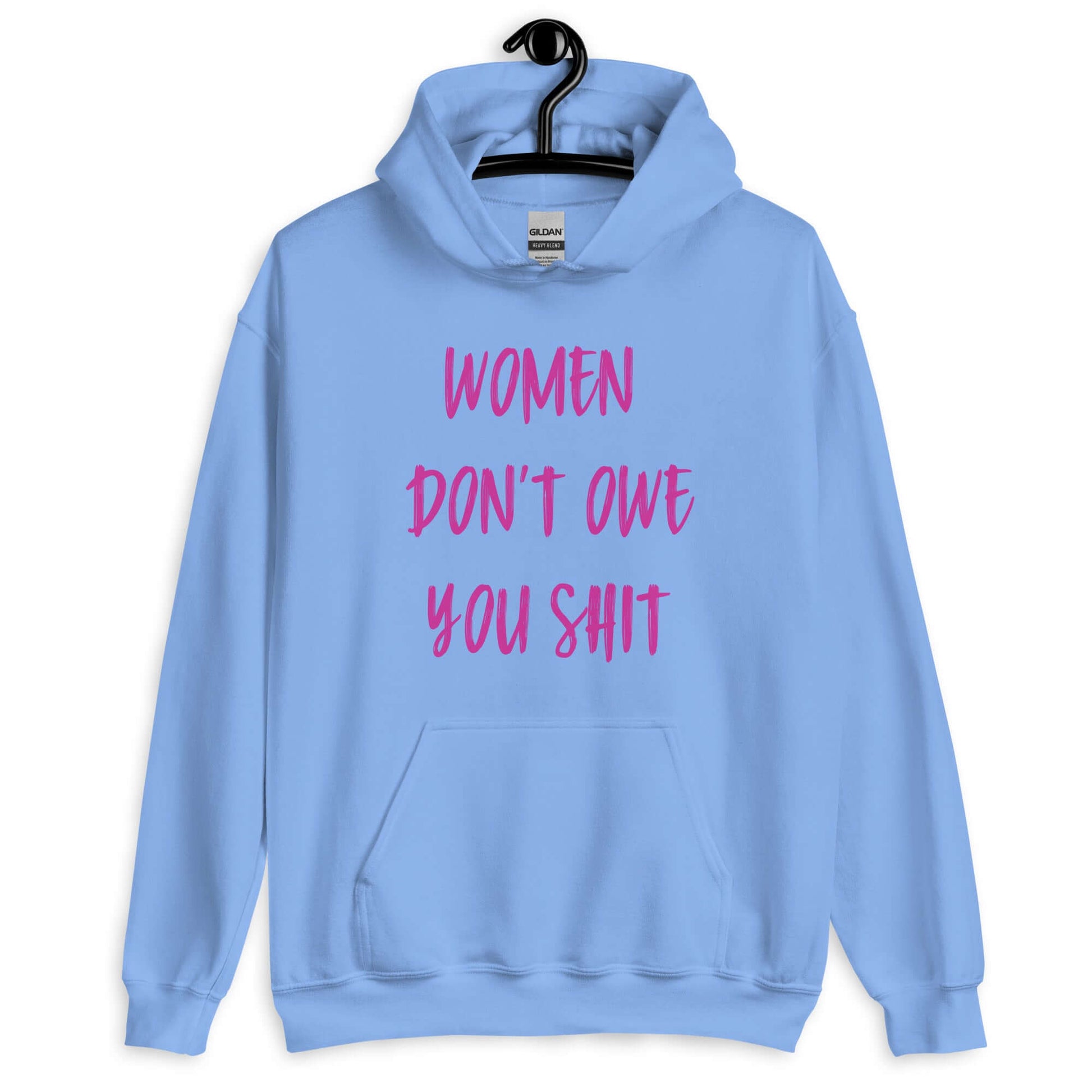 Carolina blue hoodie sweatshirt with the words Women don't owe you shit printed on the front in pink.