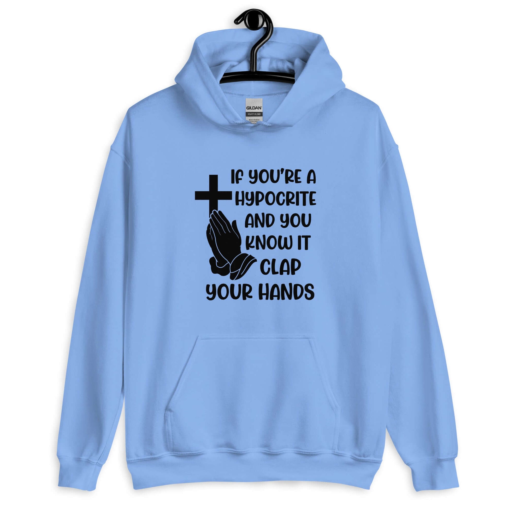 Carolina blue hoodie sweatshirt with image of a cross and praying hands & the phrase If you're a hypocrite and you know it clap your hands printed on the front.