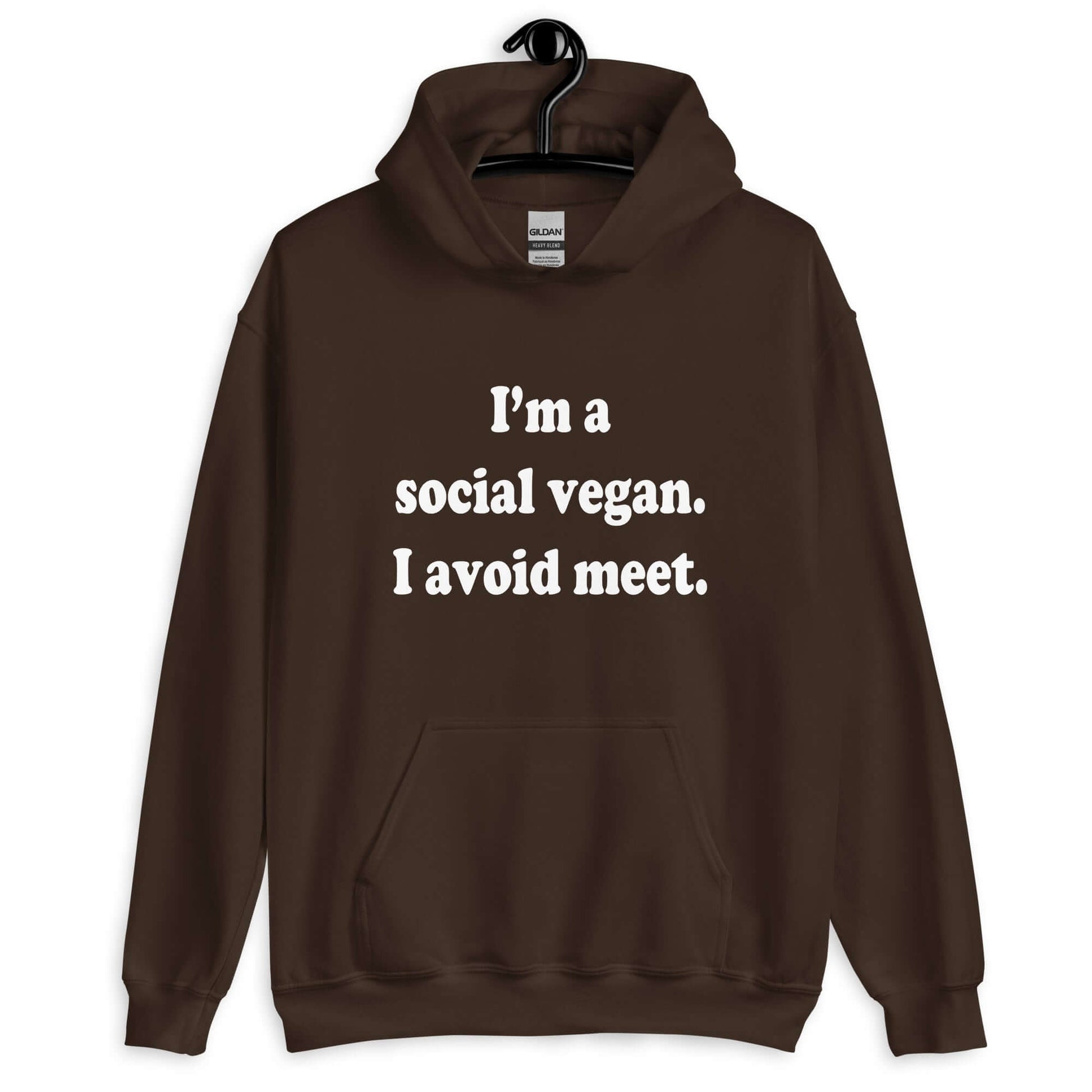 Dark chocolate brown hoodie sweatshirt with the pun phrase I'm a social vegan, I avoid meet printed on the front.