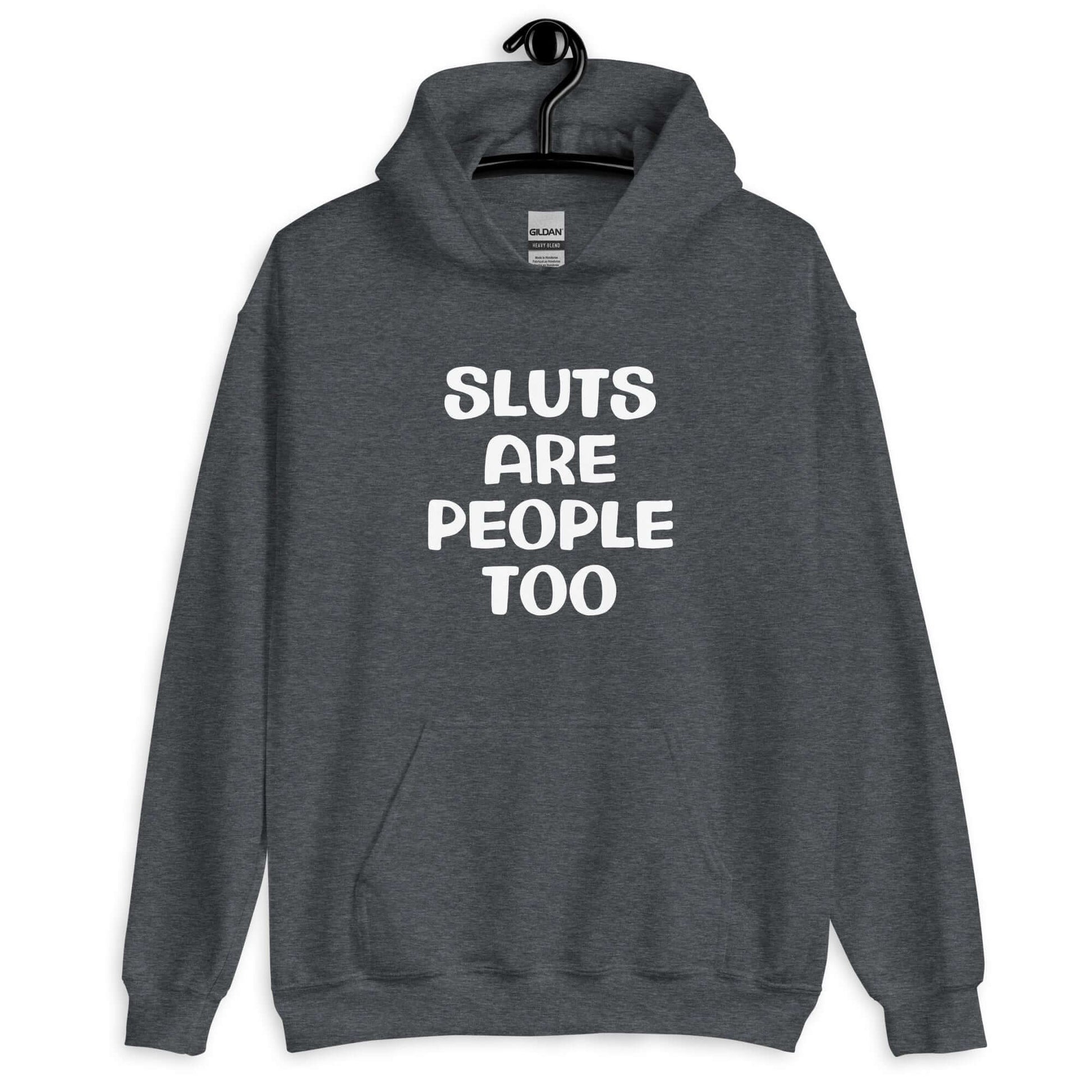 Dark heather grey hoodie sweatshirt with the phrase Sluts are people too printed on the front.