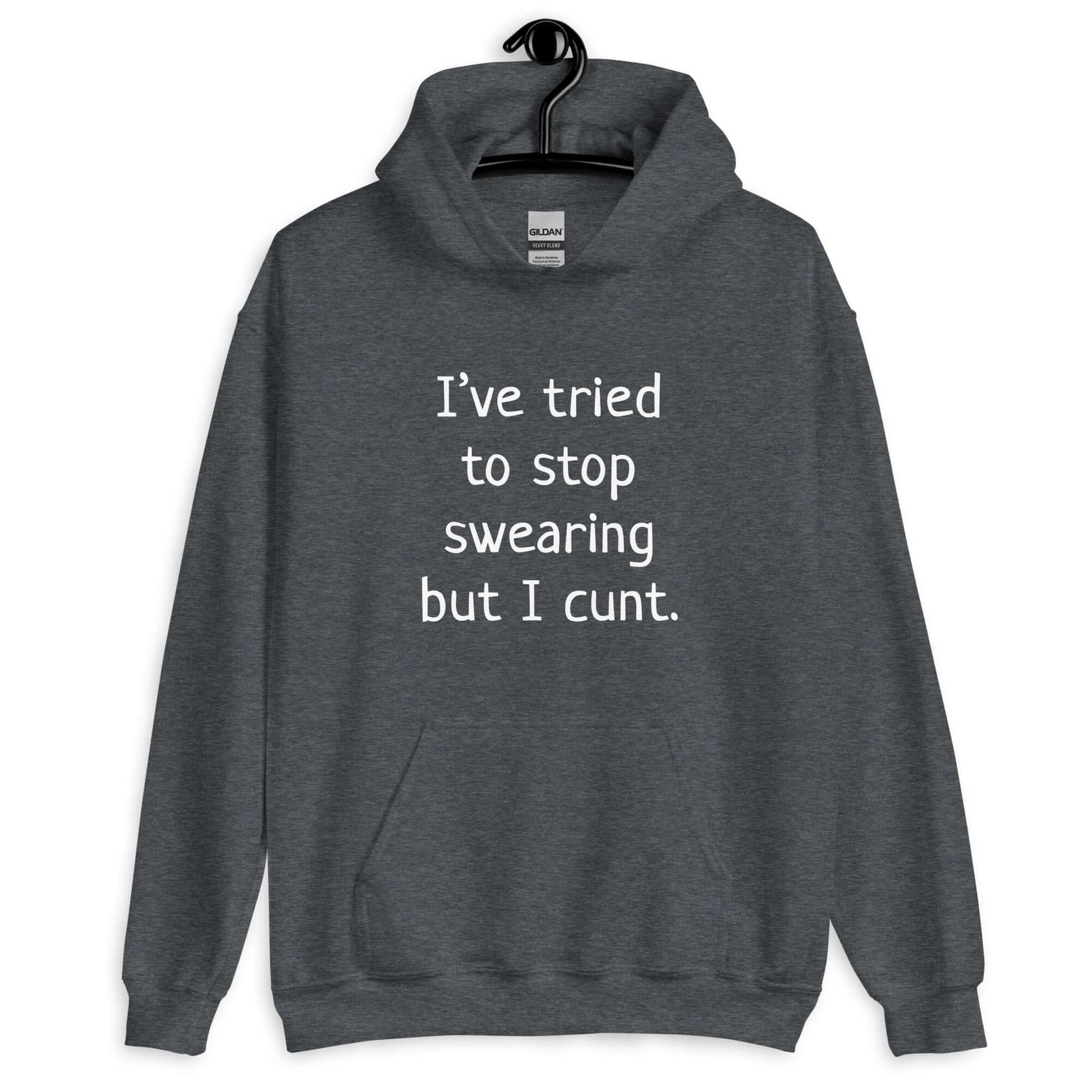 Dark heather grey hoodie sweatshirt with the phrase I've tried to stop swearing but I cunt printed on the front.