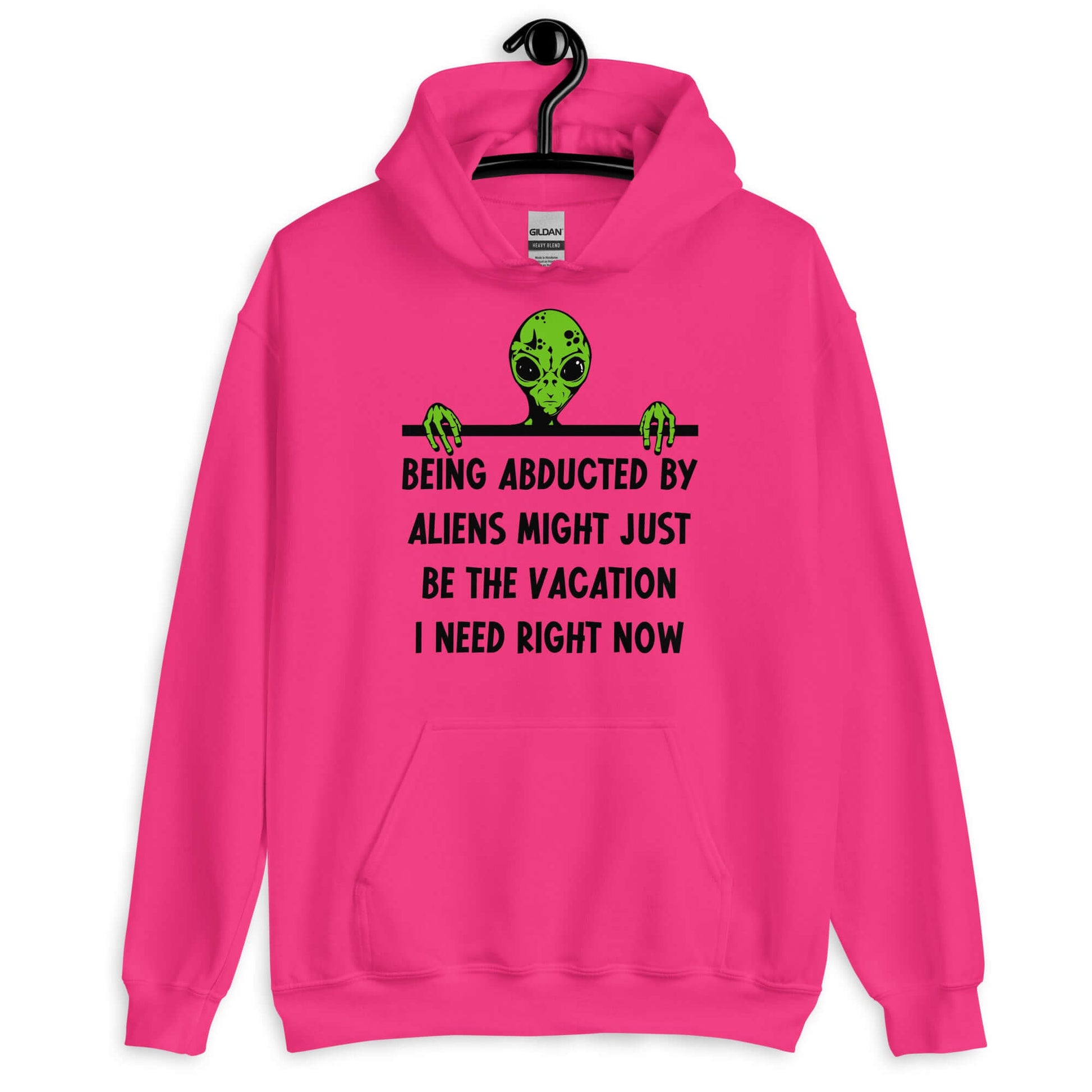 Heliconia pink hoodie with an image of a green alien and the phrase Being abducted by aliens might just be the vacation I need right now printed on the front of the sweatshirt.