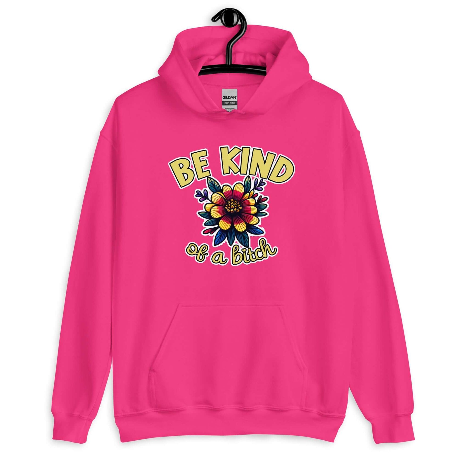 Heliconia pink hoodie sweatshirt with an image of a flower and the words Be kind above the flower in yellow bold block font. The words Of a bitch are smaller in script font under the flower. The design is printed on the front of the hoodie.