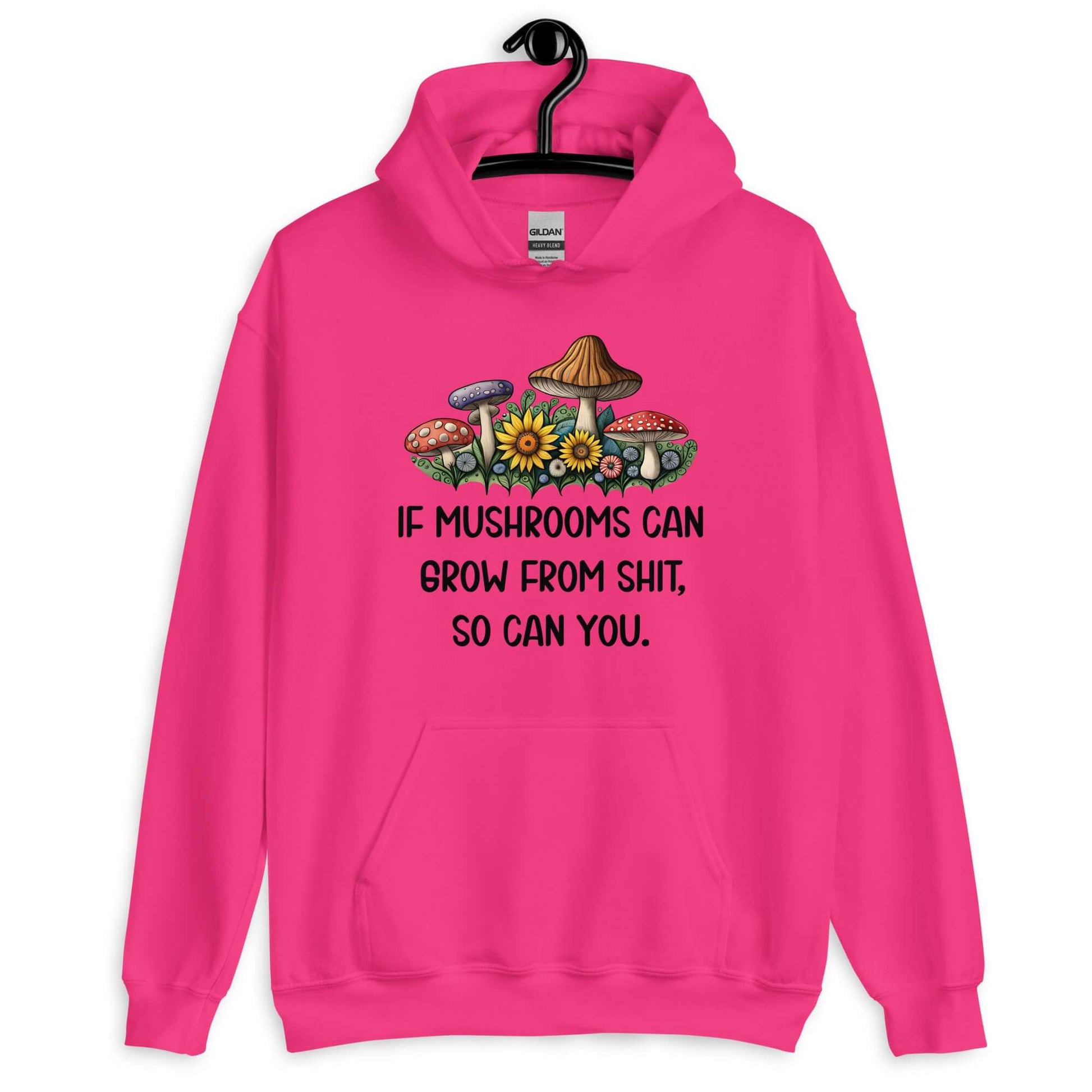 Heliconia pink hoodie sweatshirt with images of mushrooms and the phrase If mushrooms can grow from shit so can you printed on the front.